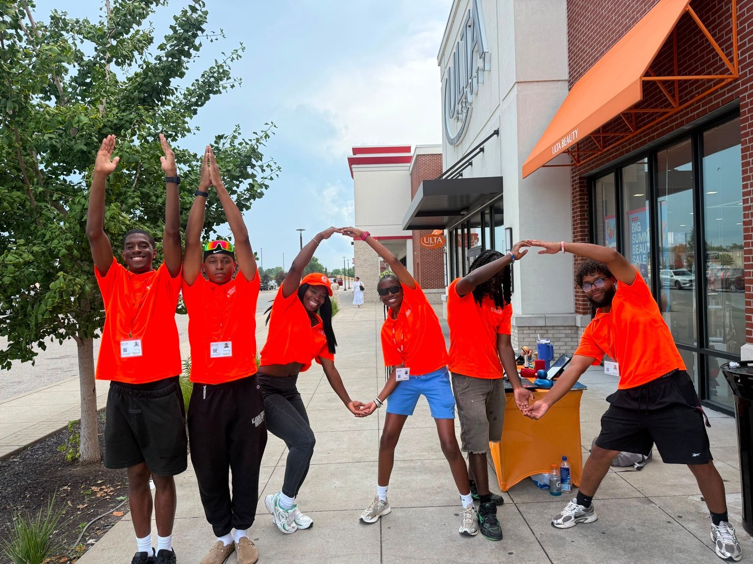 Diverse Uptown Connect team members together during an outreach day