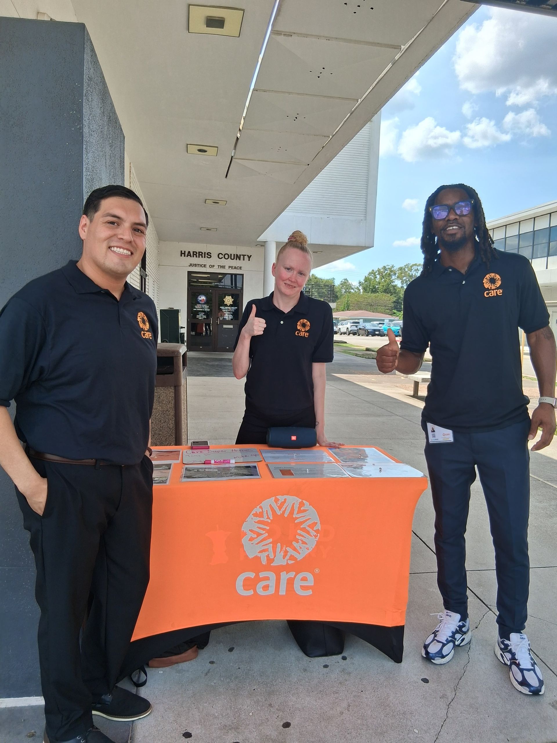 Uptown Connect representatives sharing CARE information at an outreach table