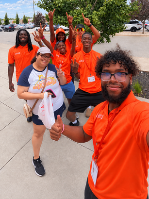 Uptown Connect teammates celebrating together during a campaign day