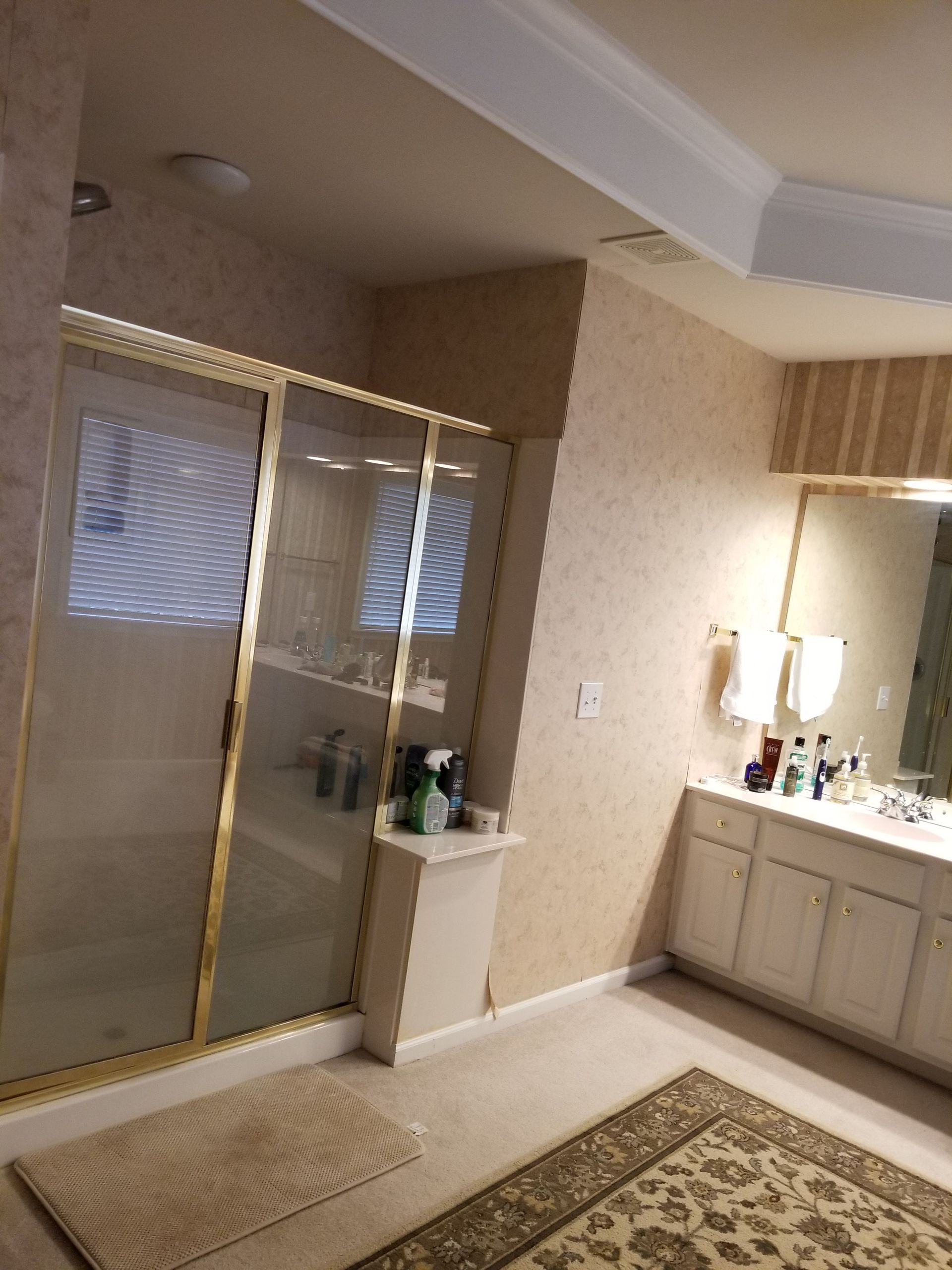 A bathroom with a bathtub, sink, and shower.