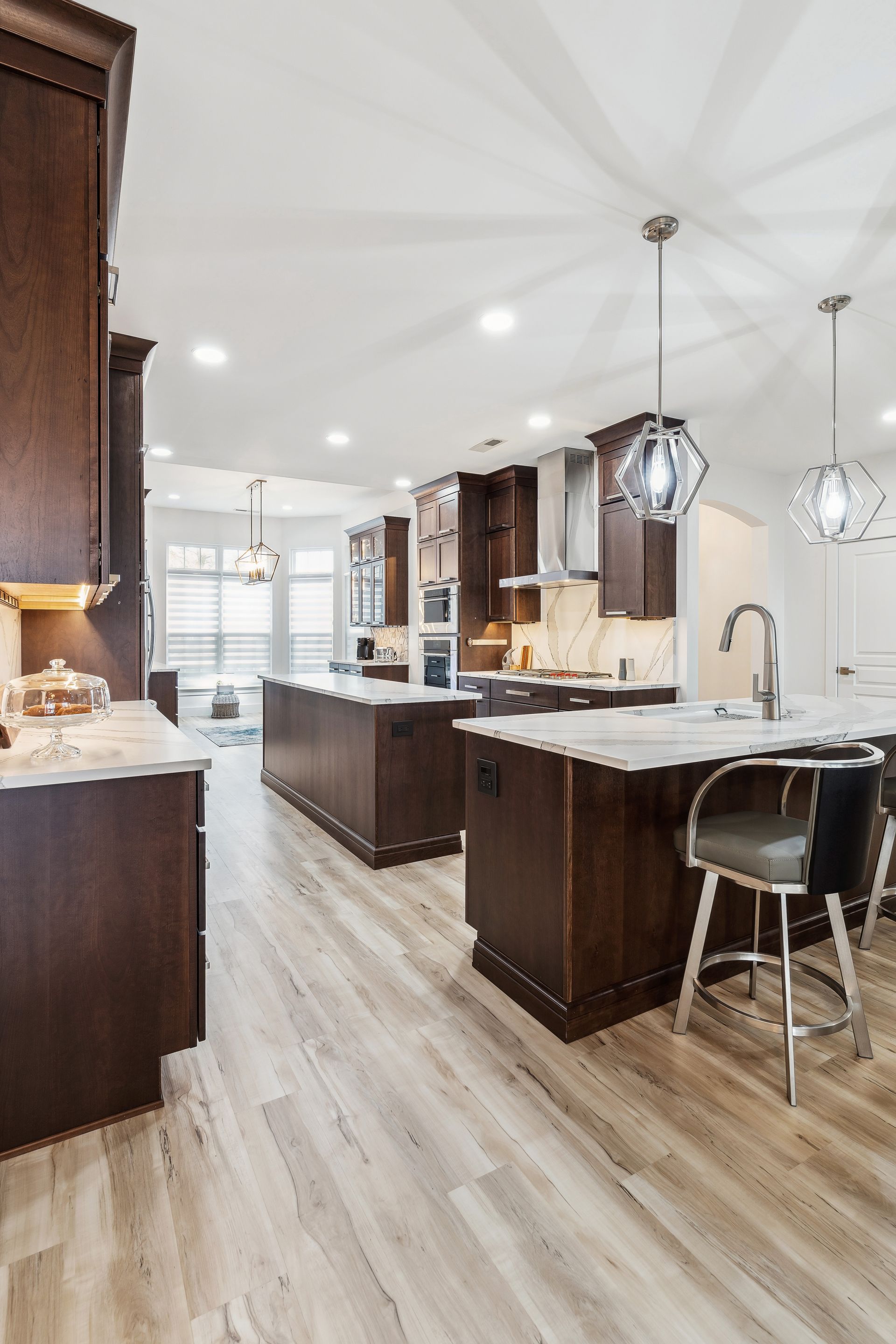A kitchen with a lot of cabinets and a large island in the middle.