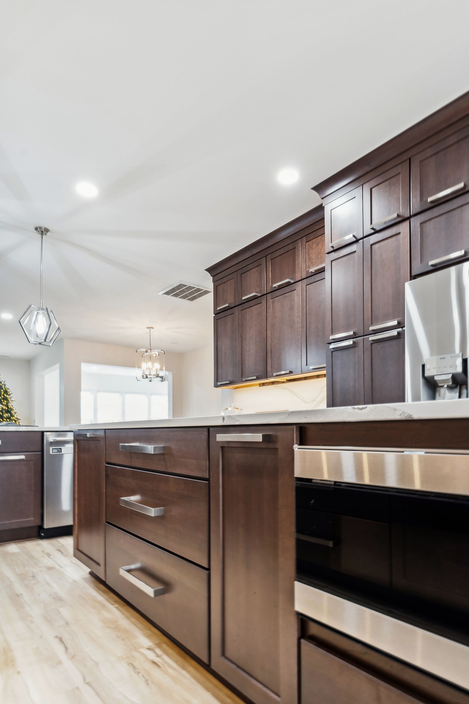 A kitchen with wooden cabinets and stainless steel appliances.