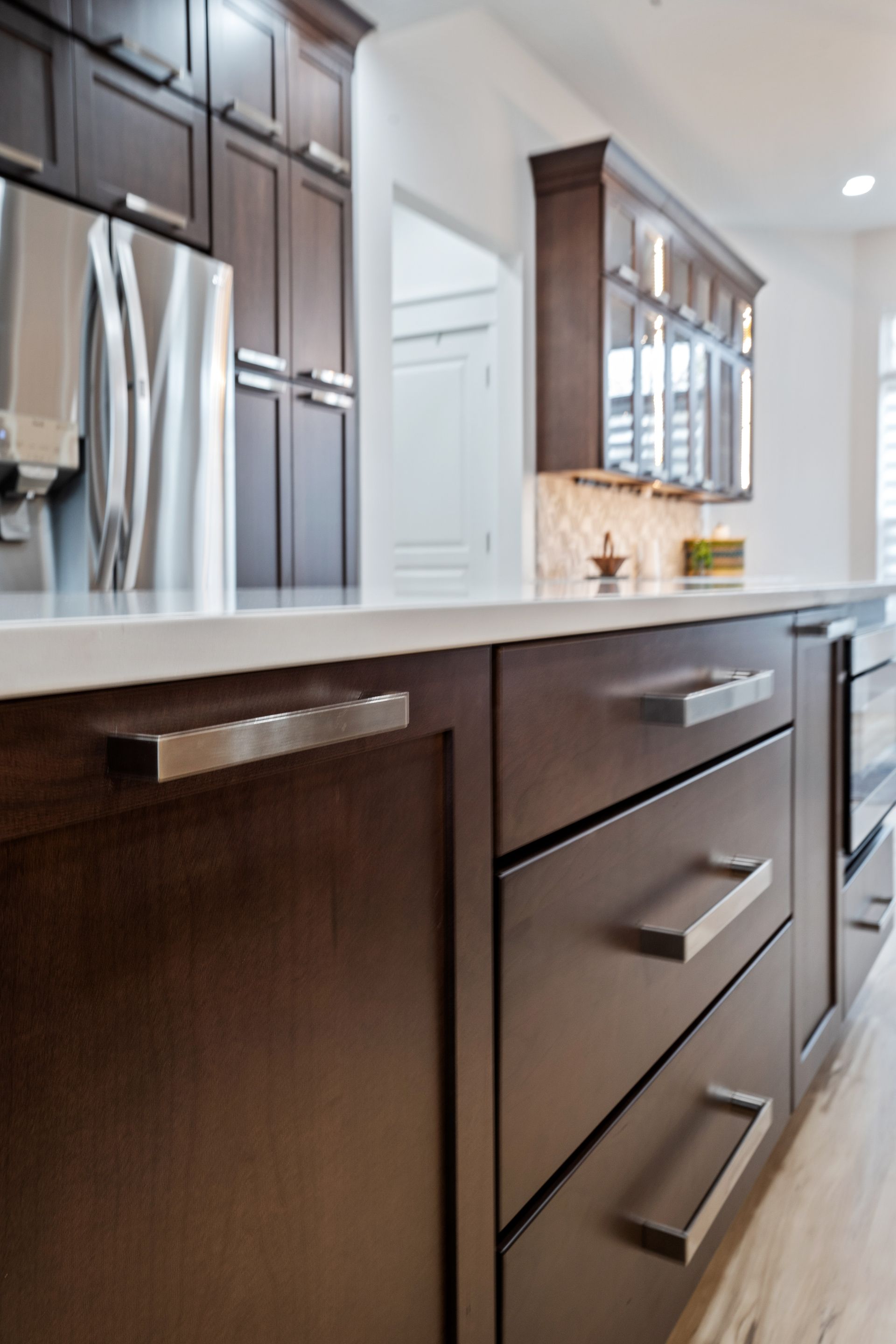 A kitchen with stainless steel appliances and wooden cabinets