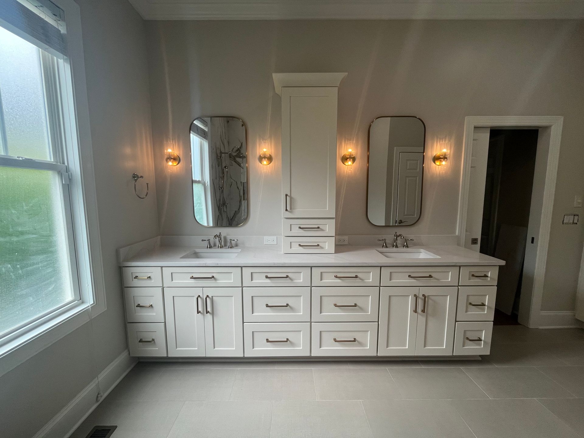 A bathroom with two sinks and two mirrors.