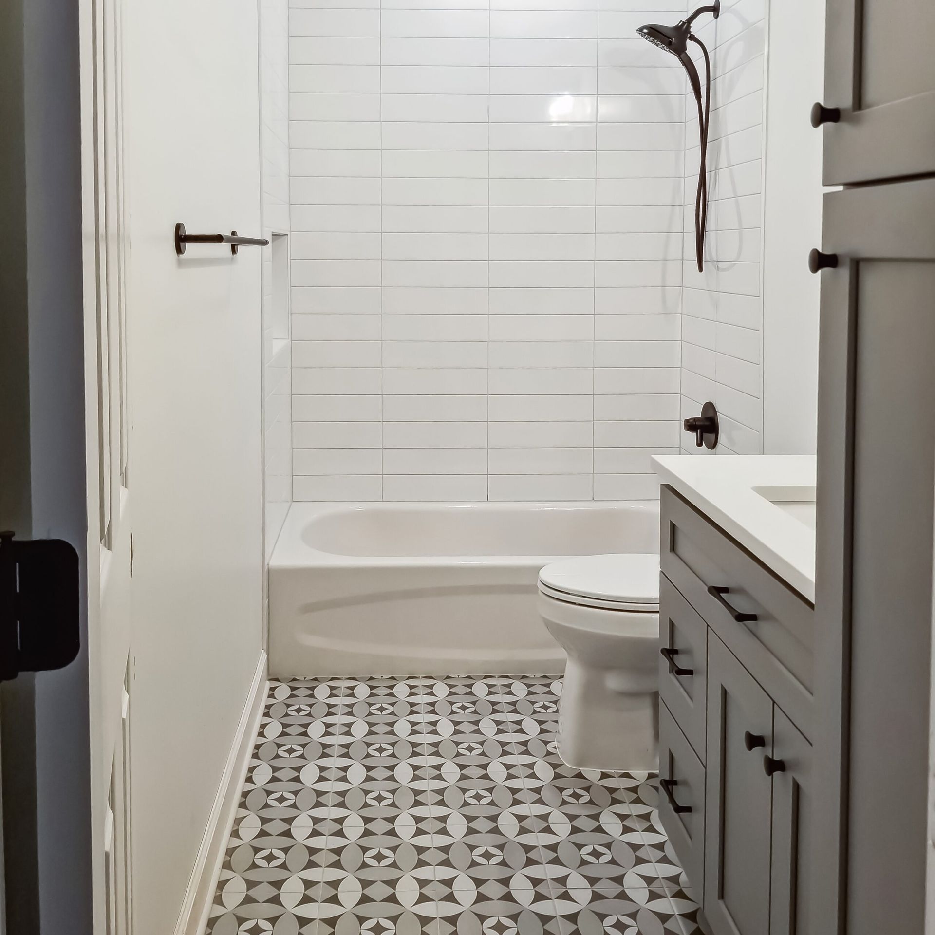 A bathroom with a bathtub toilet and sink