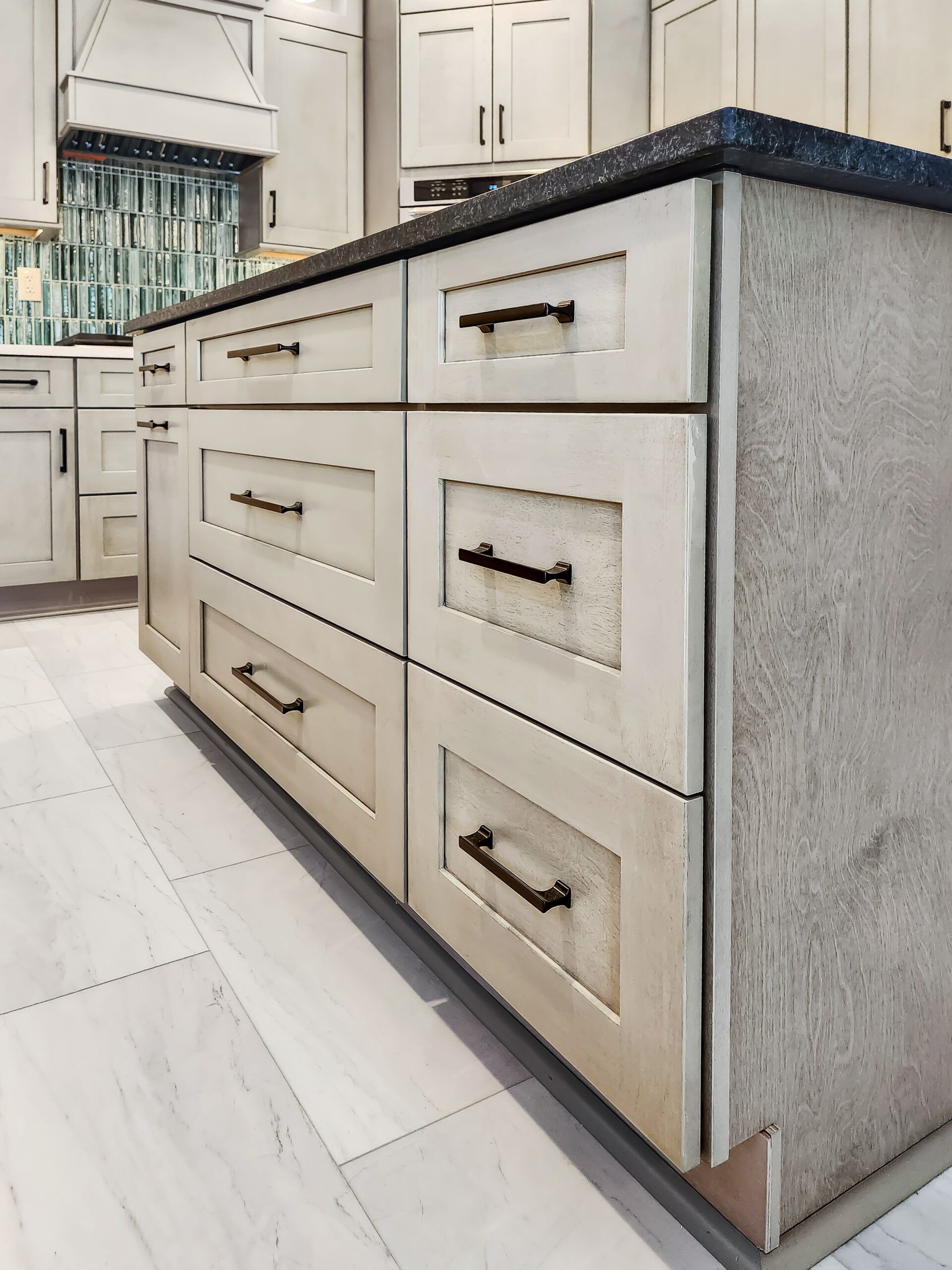 A kitchen with a large island and lots of drawers