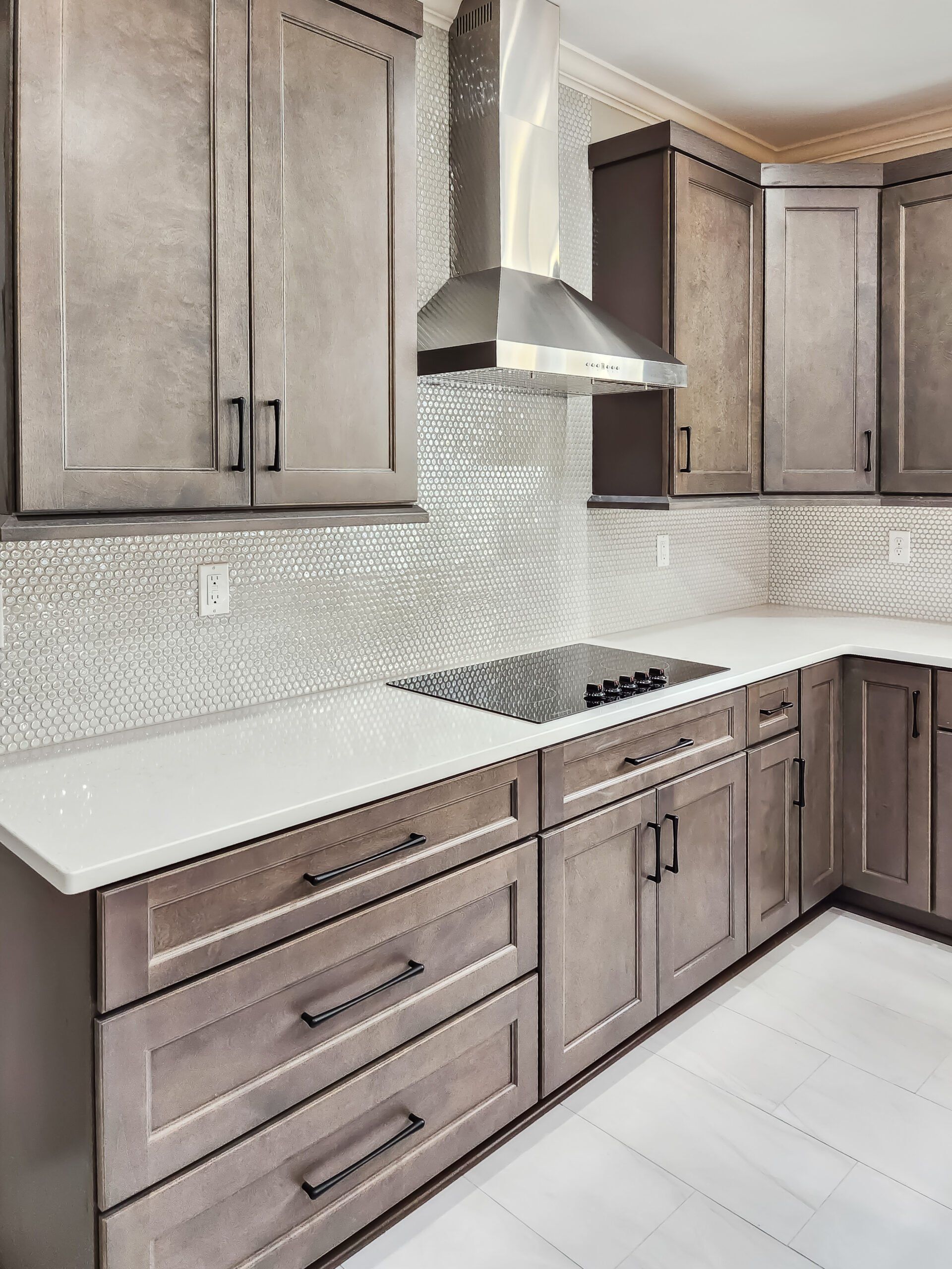 A kitchen with wooden cabinets and a stove top oven
