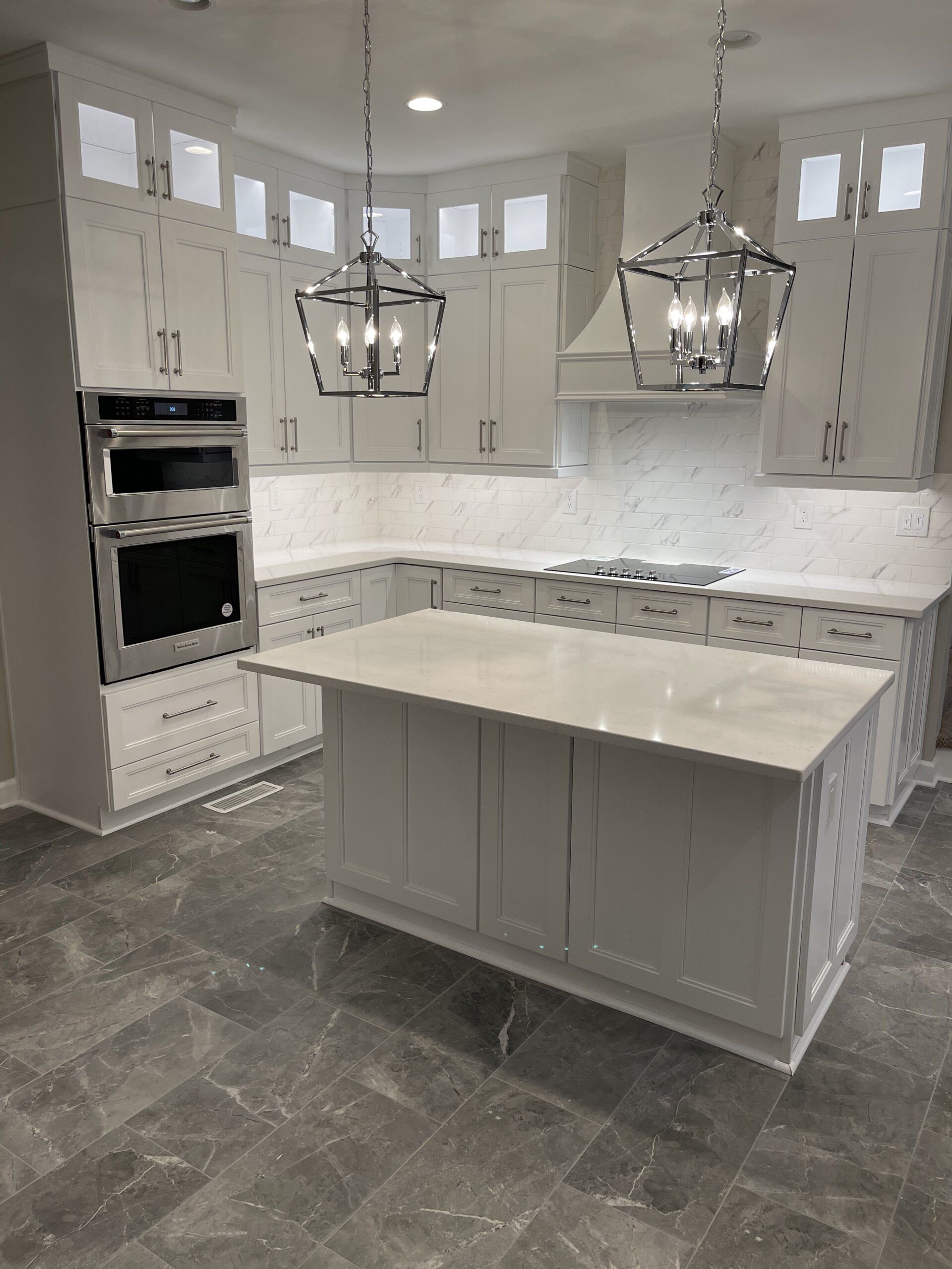 There is a large island in the middle of the kitchen.