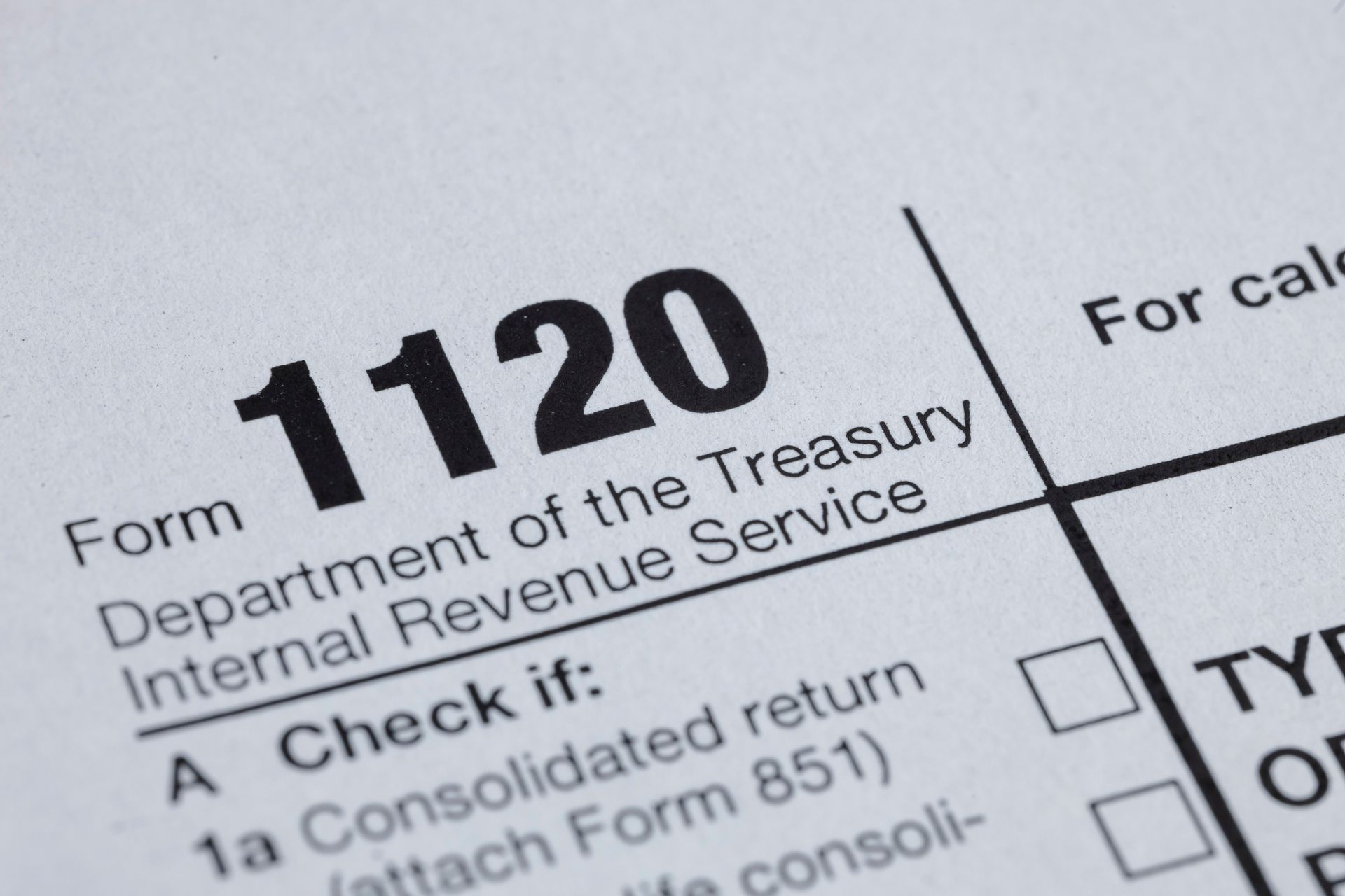 Close-up of a U.S. Corporate Income Tax Return form (Form 1120) with Close-up of a U.S. Corporate Income Tax Return form (Form 1120) with