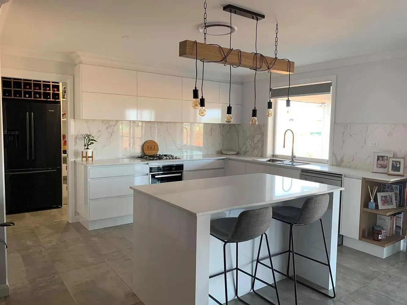 Modern White Kitchen with Island, Pendant Lights, Bar Stools, and A Window Over the Sink — Simmonds Kitchens in Gunnedah, NSW