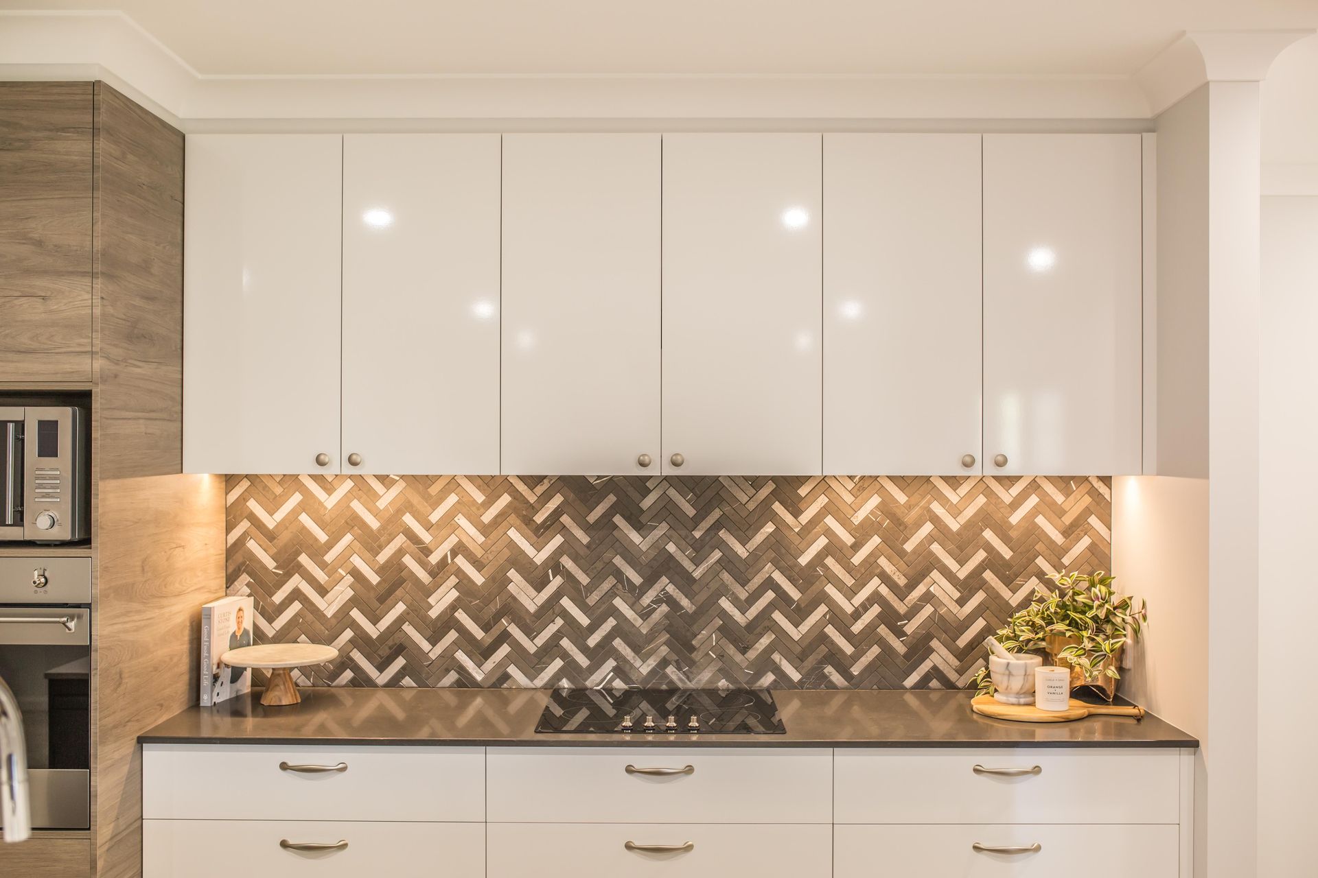 Modern White Kitchen with Glossy Cabinets, Herringbone Backsplash — Simmonds Kitchens in Narrabri, NSW