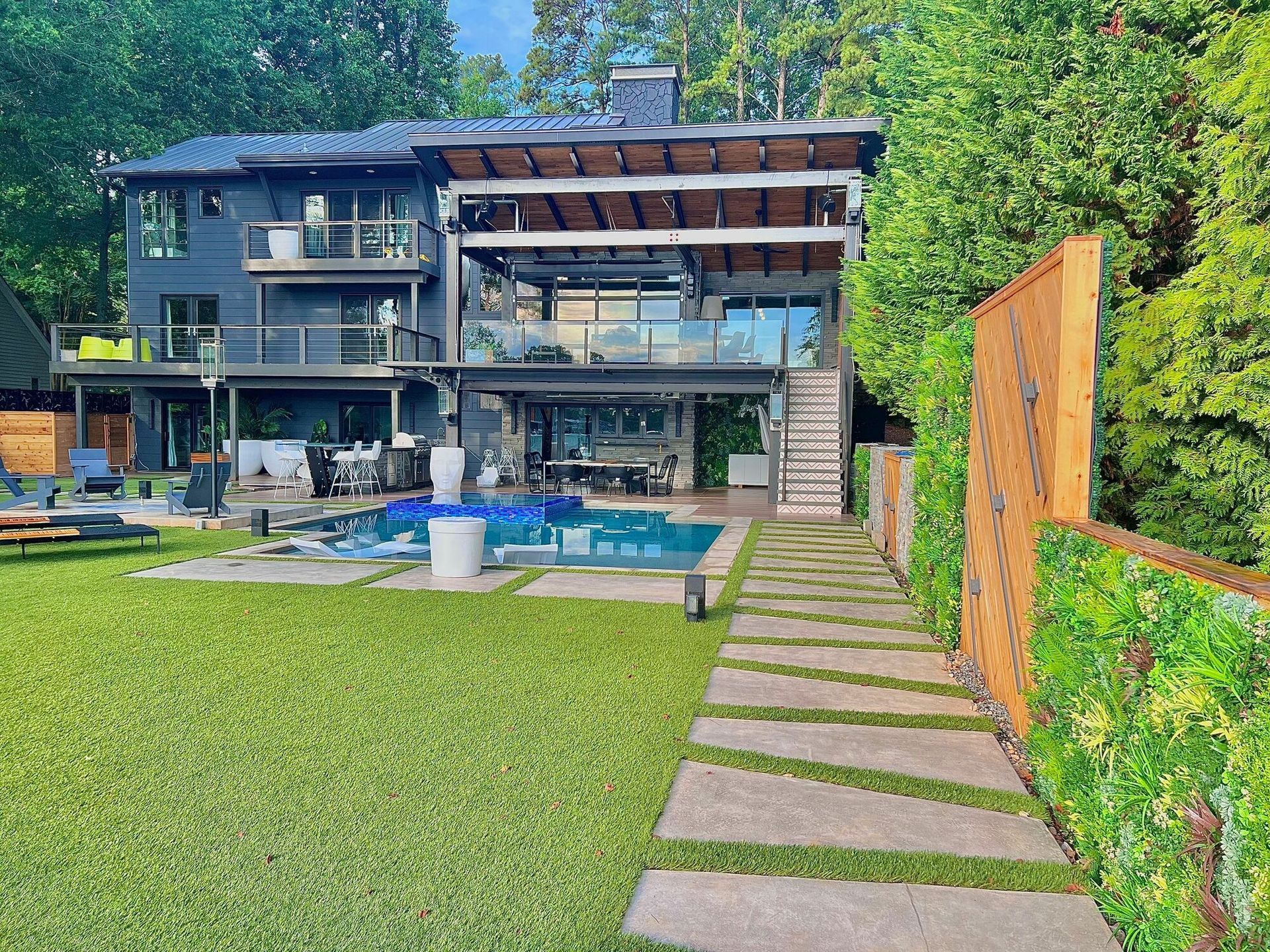 A large house with a swimming pool in the backyard.