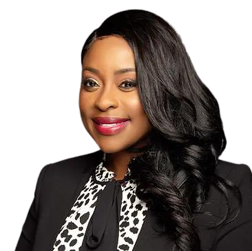 Portrait of a smiling woman in a black blazer and patterned blouse on a white background