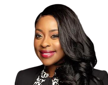 Studio headshot of a smiling person with long black hair, wearing a black outfit on a white background