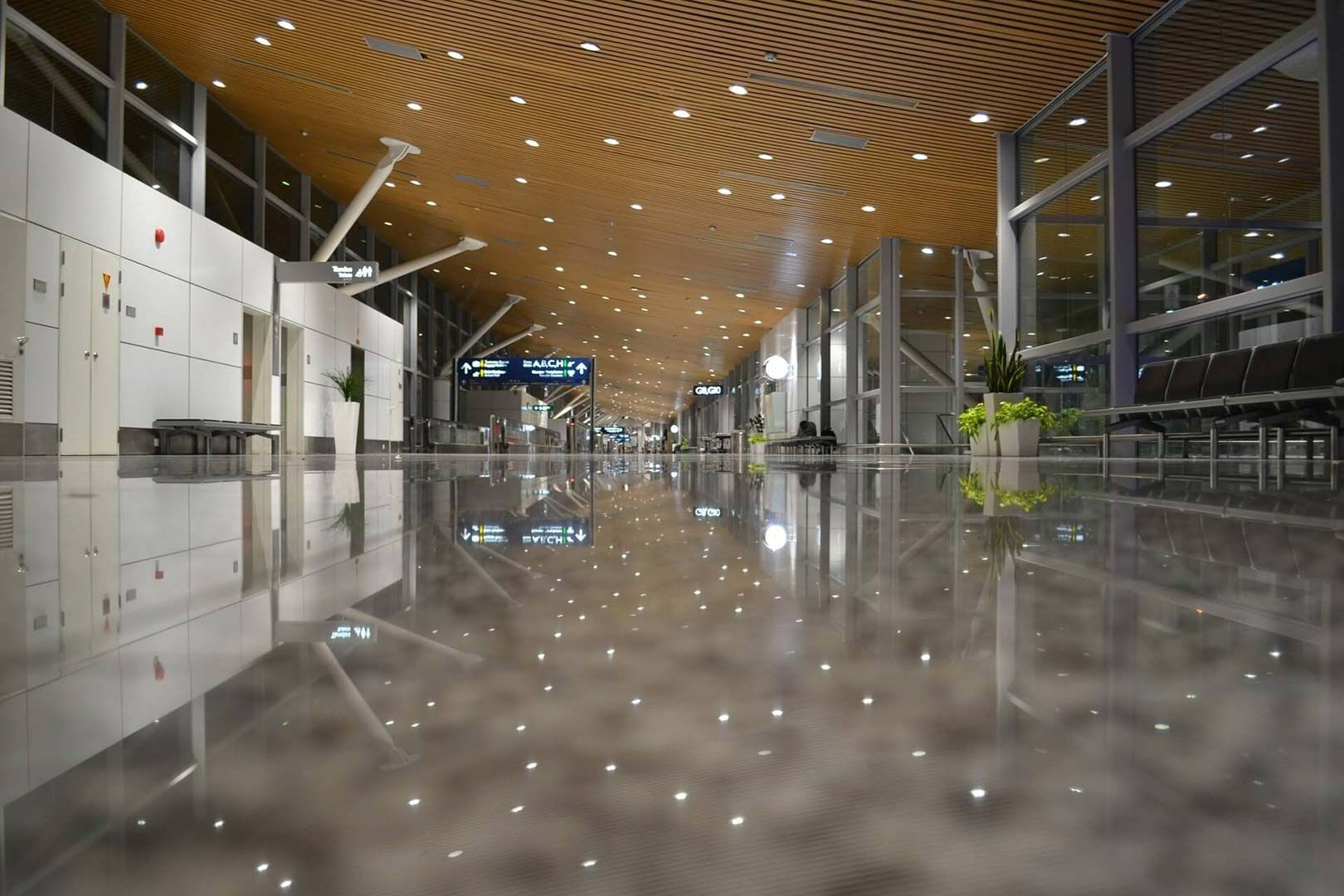 An Empty Airport Terminal With A Reflection Of The Ceiling In The Floor — Climatech In Mooloolaba, QLD