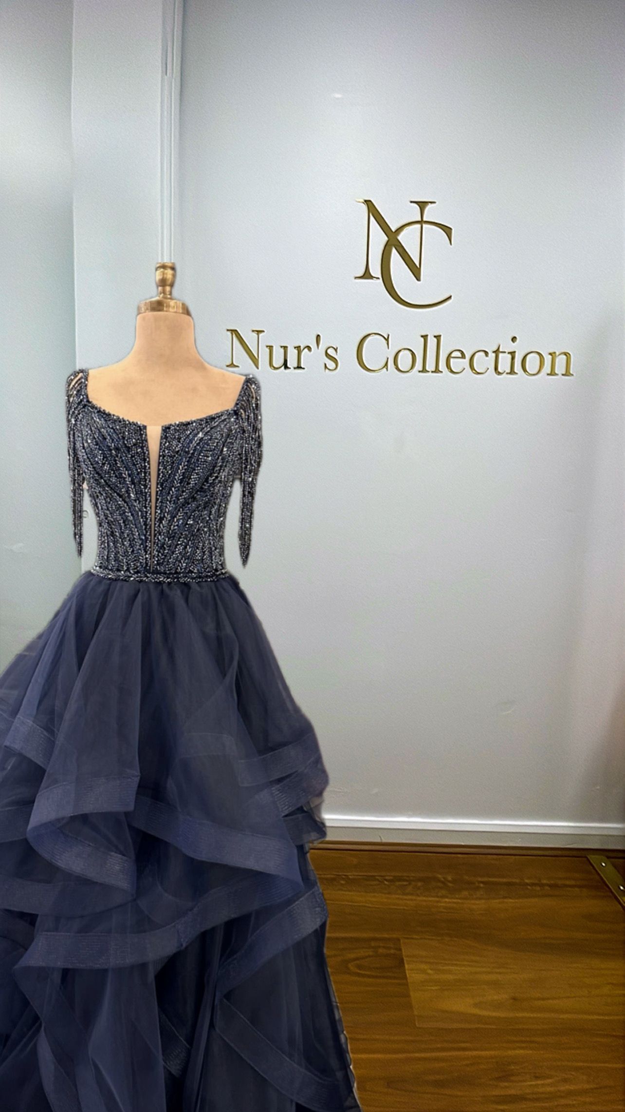 Navy Blue Strapless Formal Gown on Mannequin Beside Nurโs Collection Sign โ Nur's Collection In Rockdale, NSW