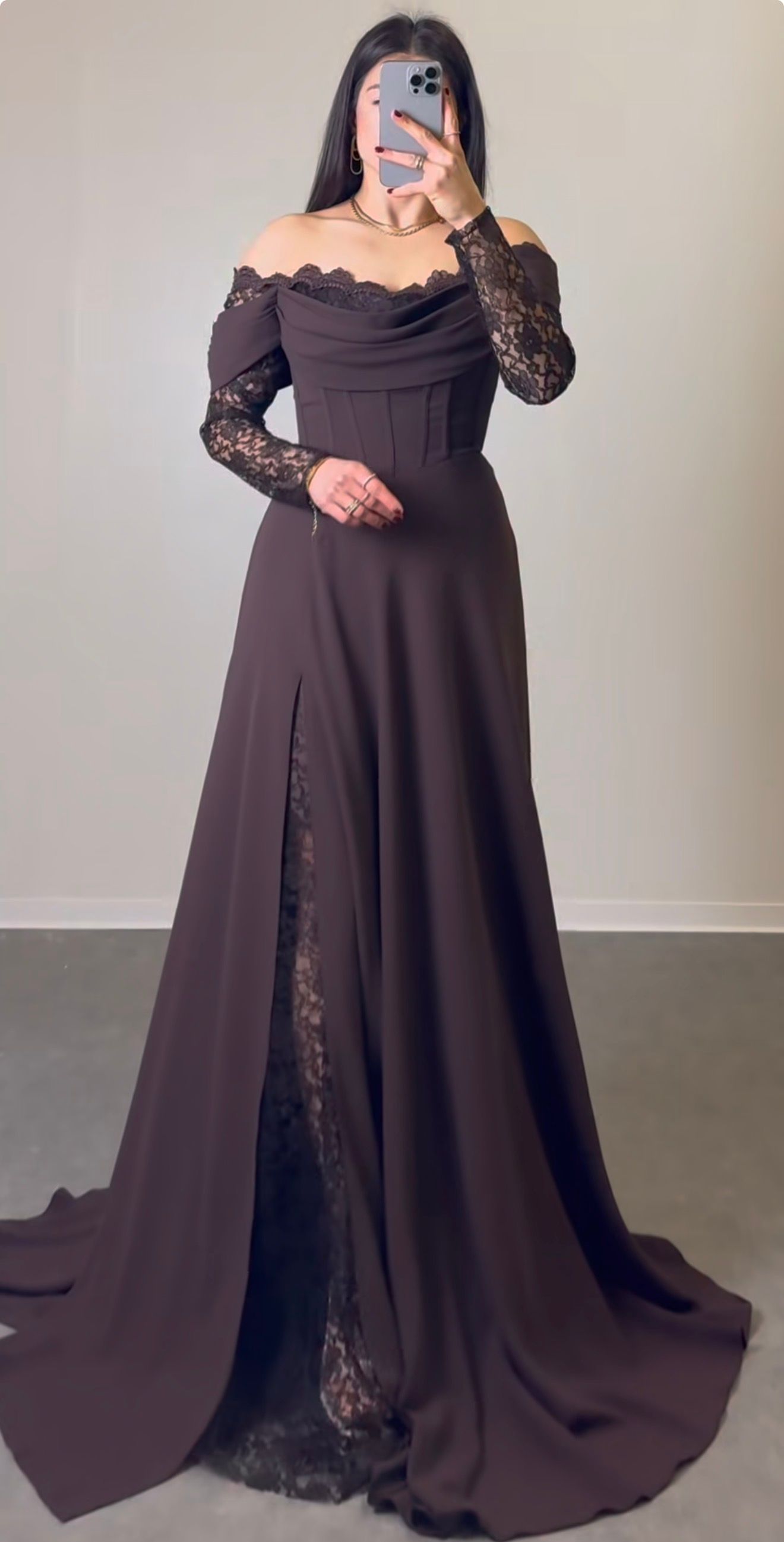 Person in a Dark Plum Off-shoulder Gown Taking a Mirror Selfie Against a Plain Wall — Nur's Collection In Rockdale, NSW