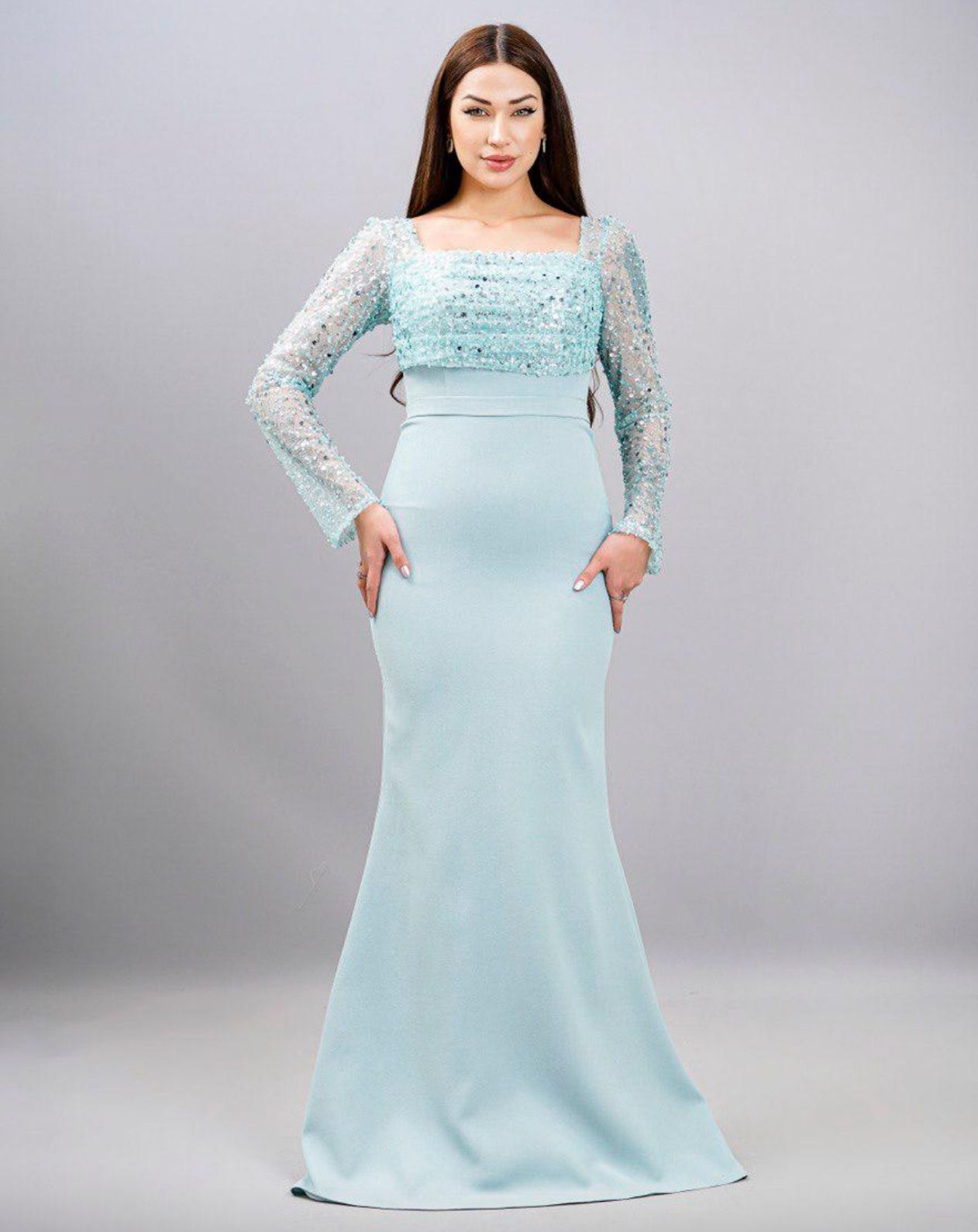 Woman in a Light Blue Embellished Long-sleeve Gown — Nur's Collection In Rockdale, NSW