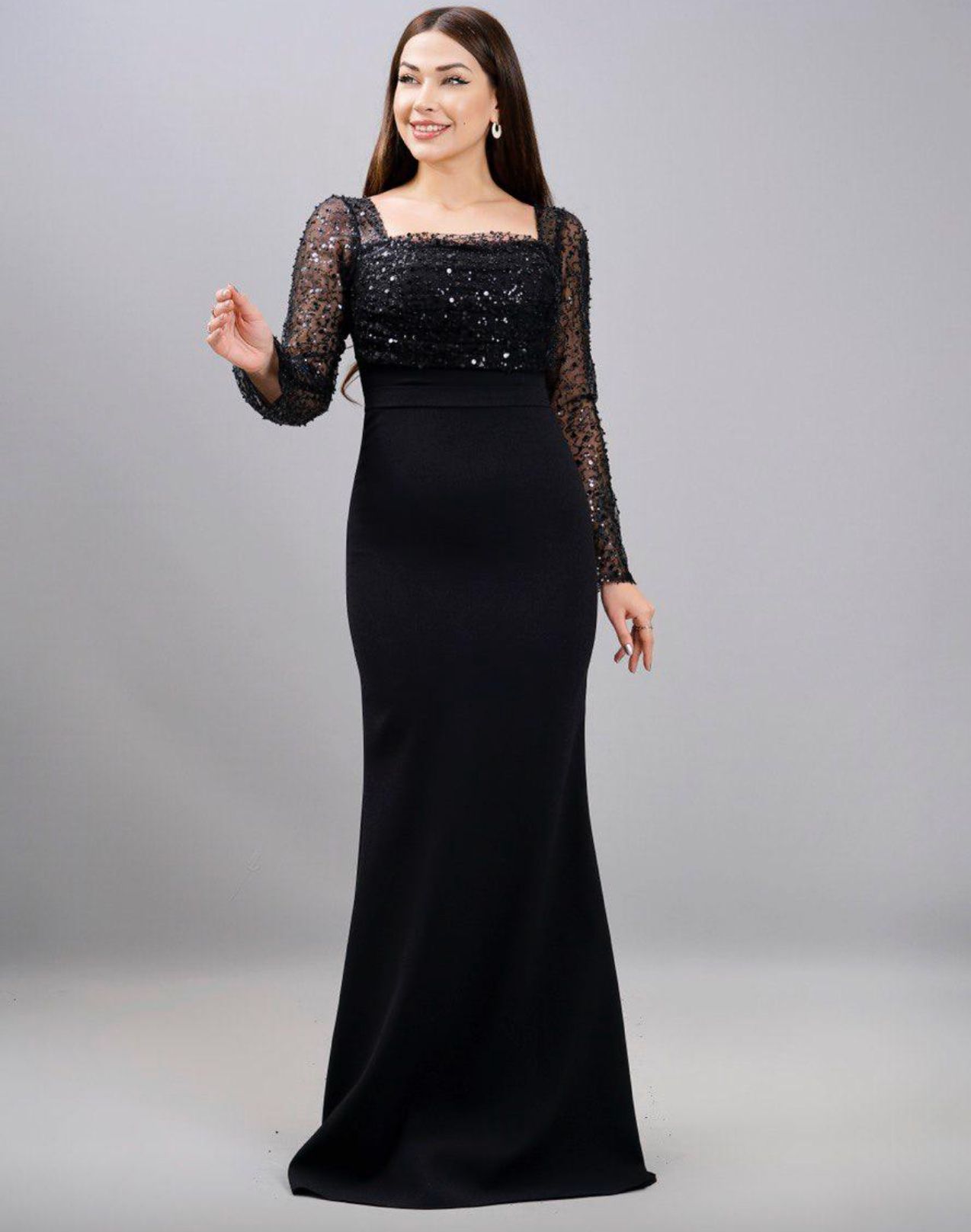 Woman in a Black Sequined Evening Gown Posing Against a Gray Backdrop — Nur's Collection In Rockdale, NSW