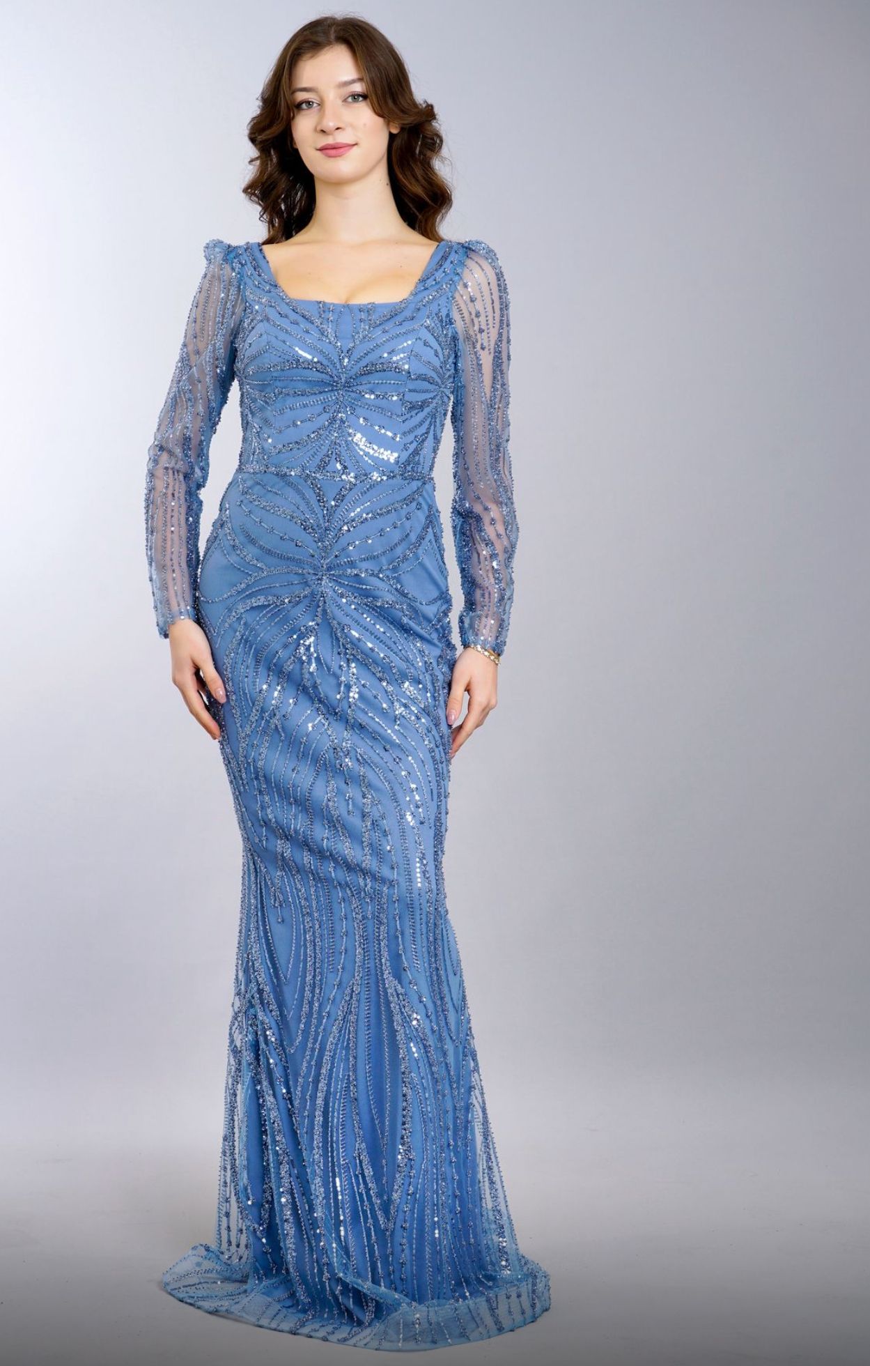 Woman in a Blue Sequined Gown With Sheer Long Sleeves — Nur's Collection In Rockdale, NSW