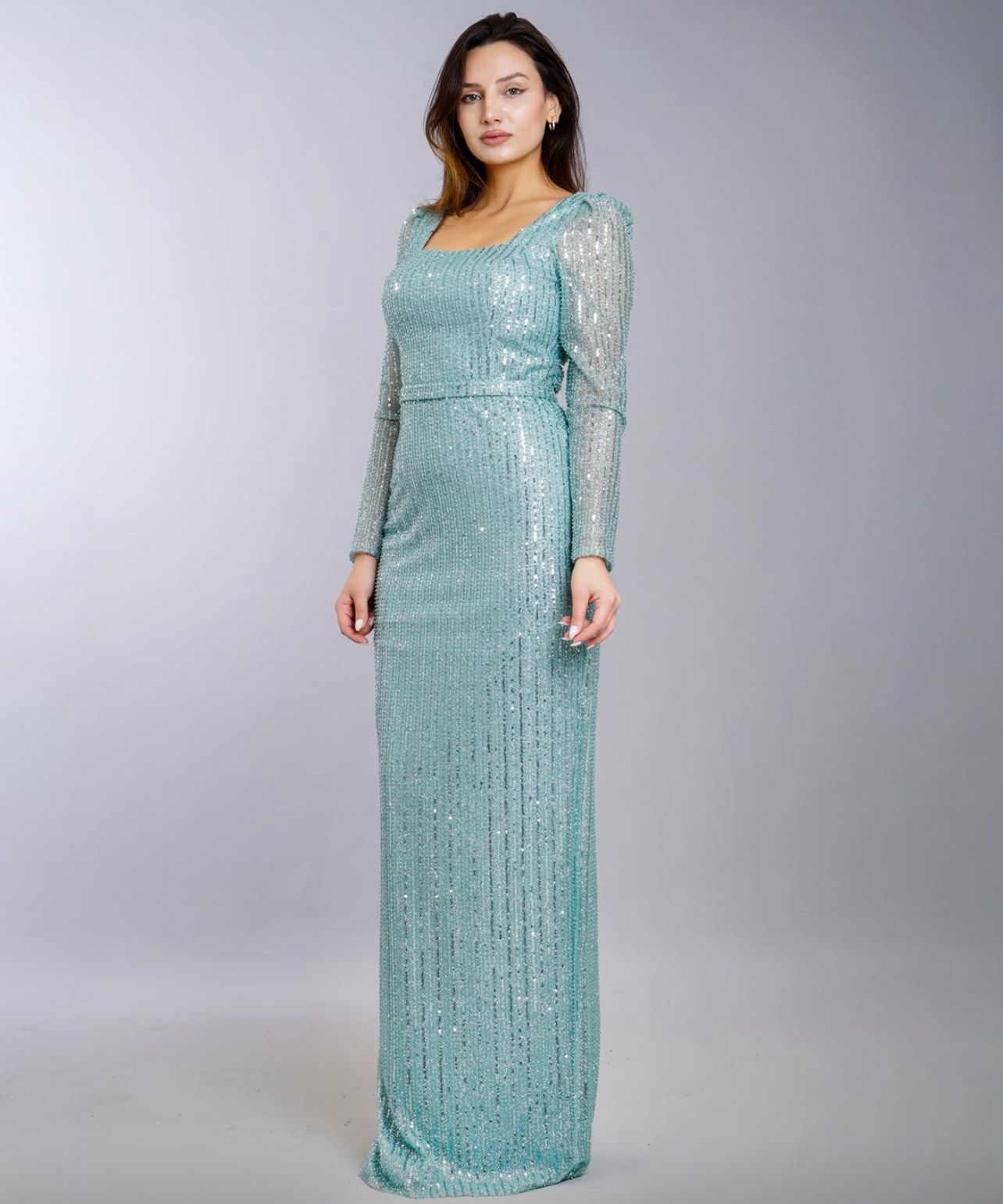 Full-length Mint Green Sequined Gown With Long Sleeves on a Studio Backdrop โ Nur's Collection In Rockdale, NSW