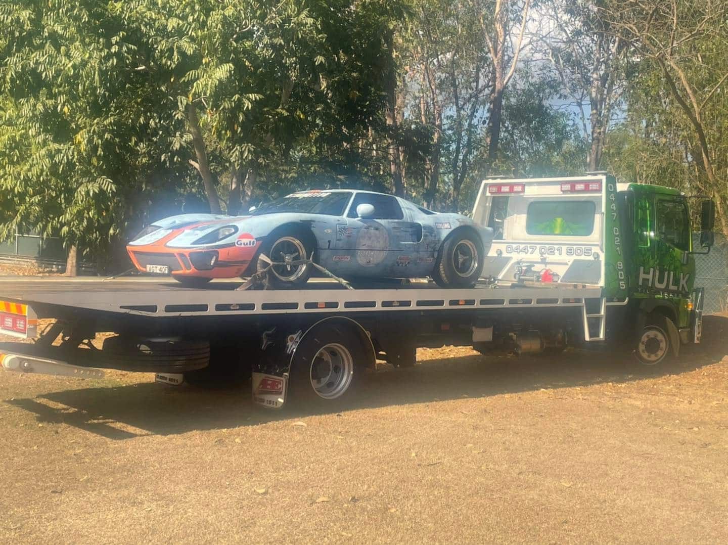 A Car Is Being Towed by A Tow Truck — Hulk Tilt Trays In Palmerston, NT
