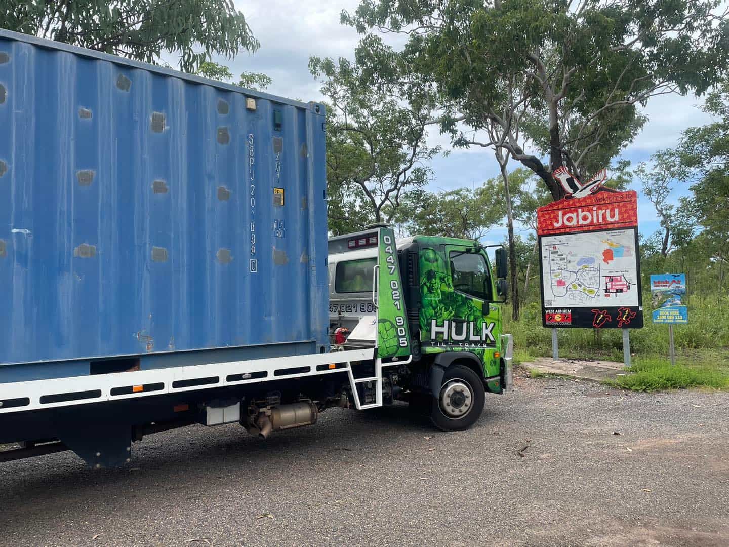 A Hulk Truck Is Parked Next to A Large Blue Container — Hulk Tilt Trays In Humpty Doo, NT