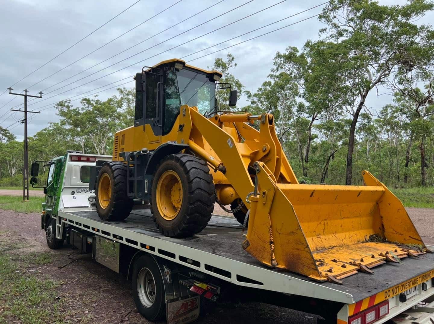 A Yellow Bulldozer Is Sitting on Top of A Tow Truck — Hulk Tilt Trays In Humpty Doo, NT