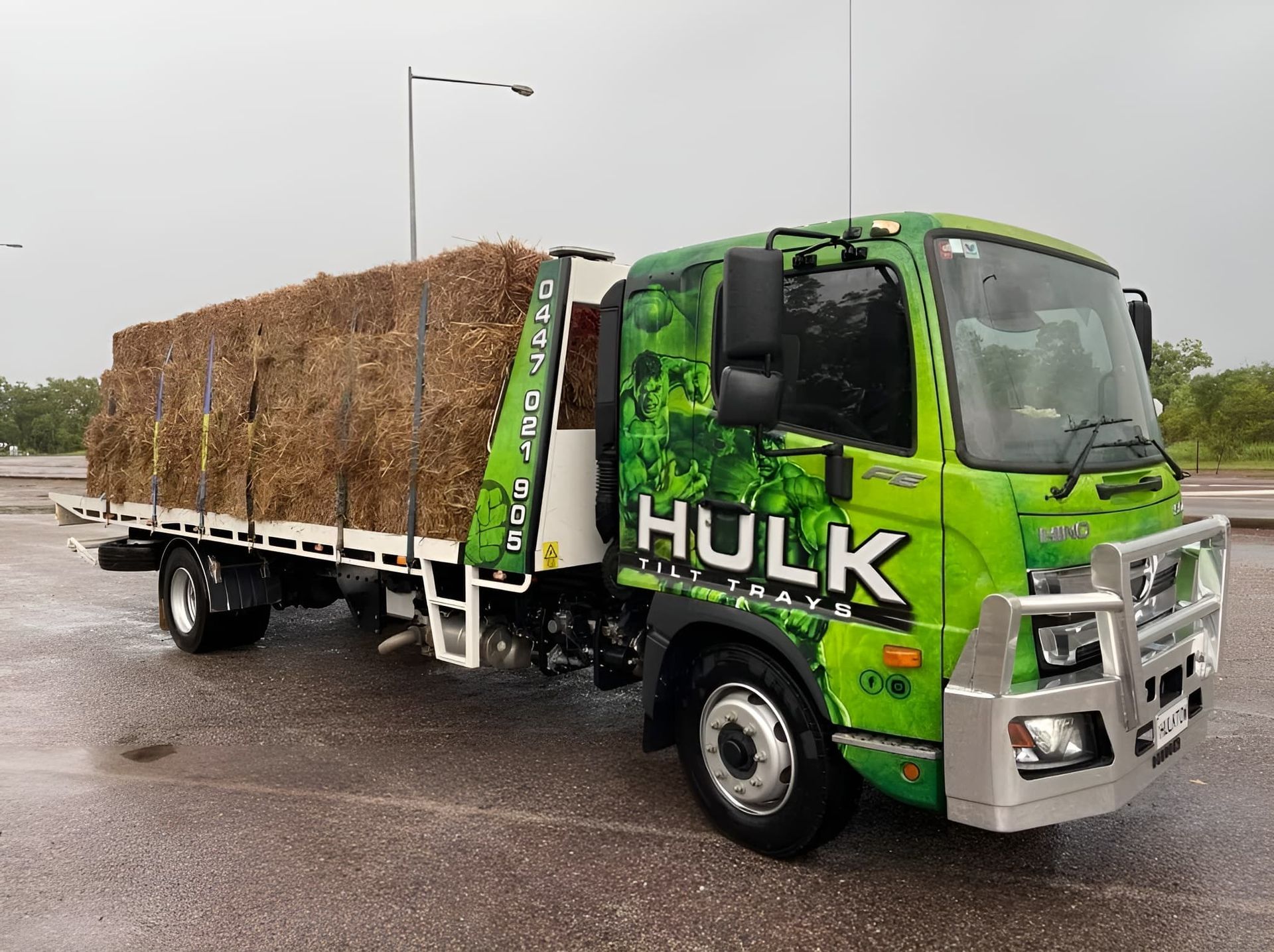 A Tow Truck Is Carrying Hay — Hulk Tilt Trays In Palmerston, NT
