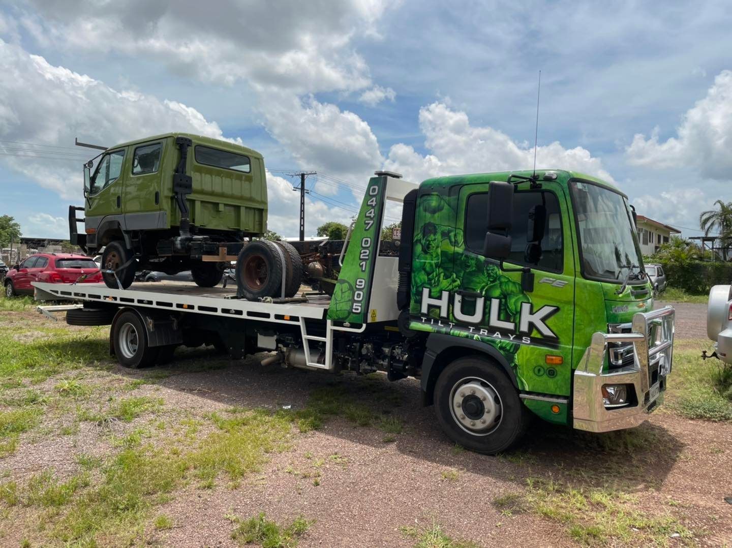 A Tow Truck Hauling a Light Truck — Hulk Tilt Trays In Humpty Doo, NT