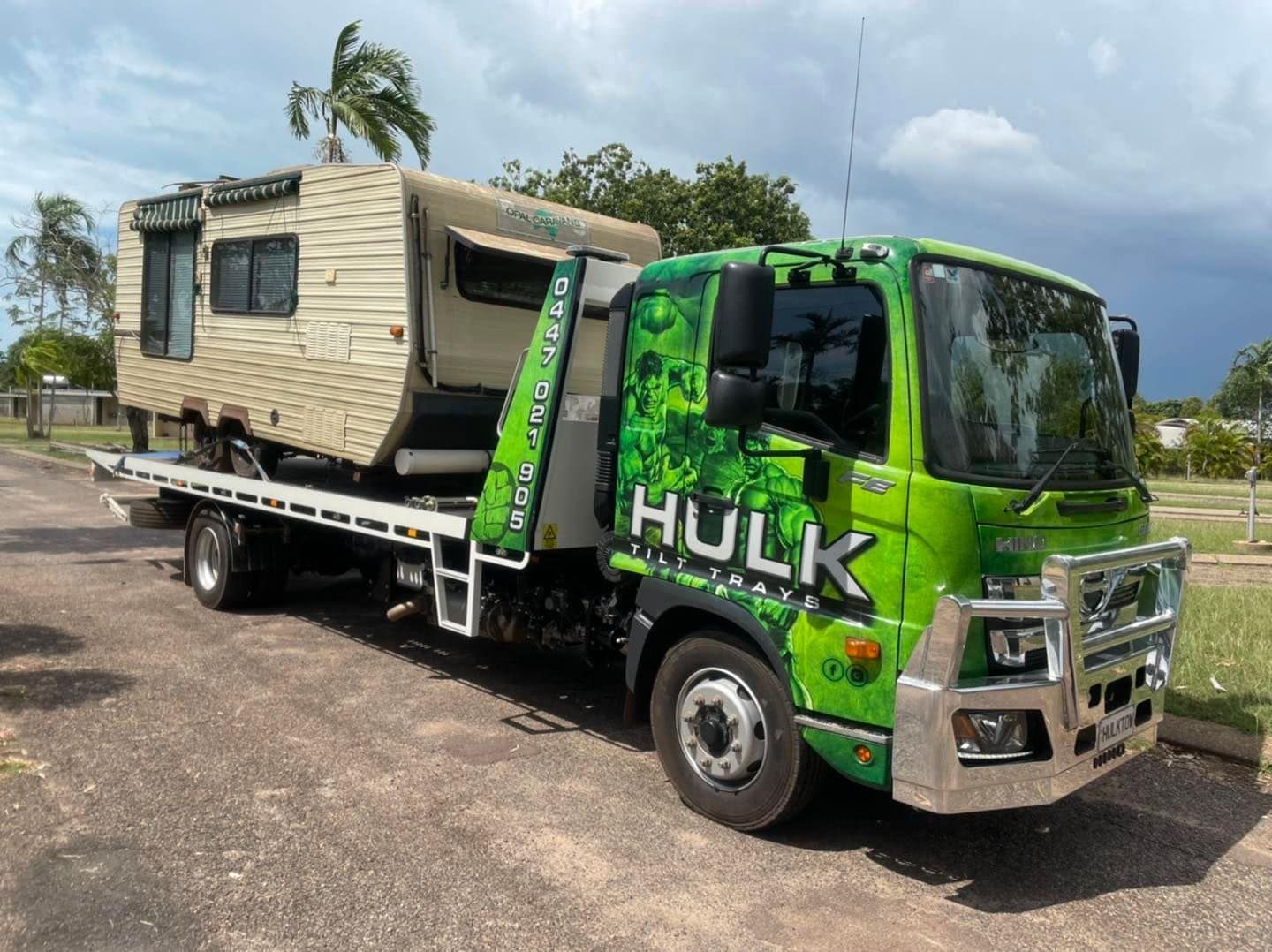 A Green Tow Truck with The Word Hulk on It Is Carrying a Trailer — Hulk Tilt Trays In Humpty Doo, NT