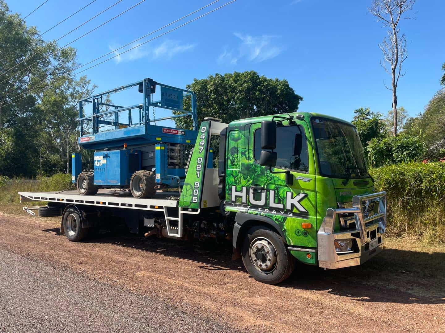 A Green Tow Truck with A Lift on The Back Is Parked on The Side of The Road — Hulk Tilt Trays In Humpty Doo, NT