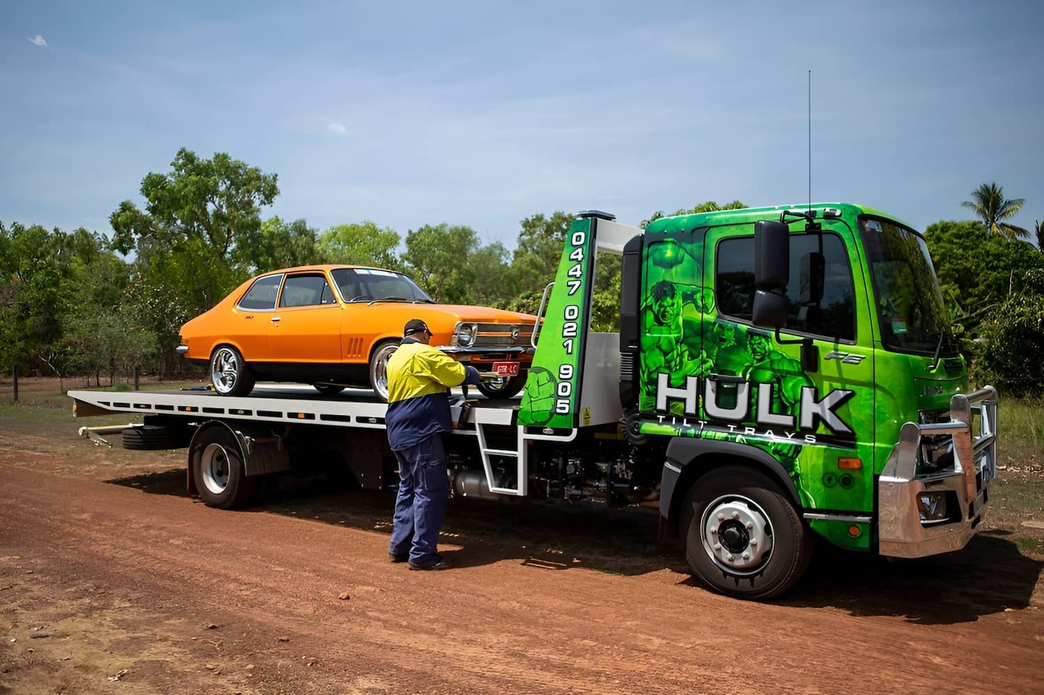 A Tow Truck with A Car on The Back of It — Hulk Tilt Trays In Humpty Doo, NT