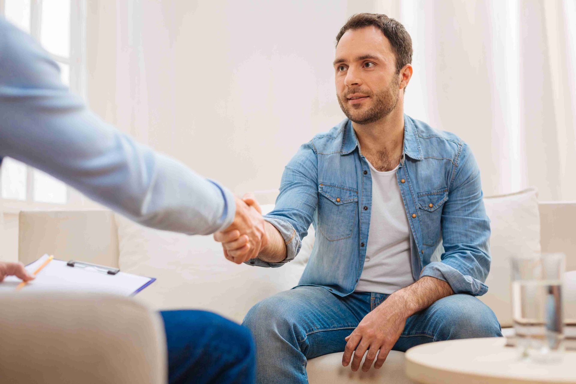 Shaking hands during a consultation for a new cabinetry build
