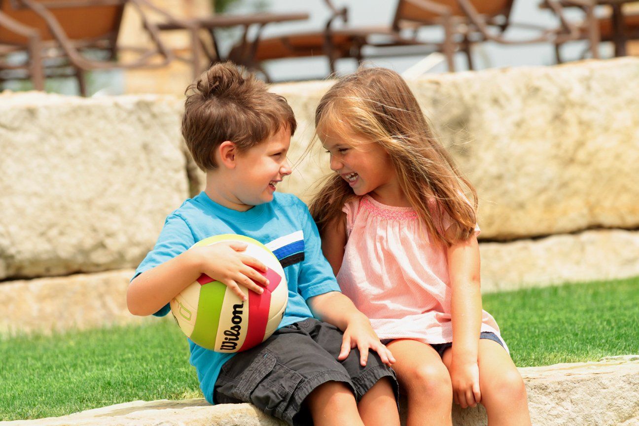 Kids Smiling at Each Other | Devonshire Living | Forney, TX 75126