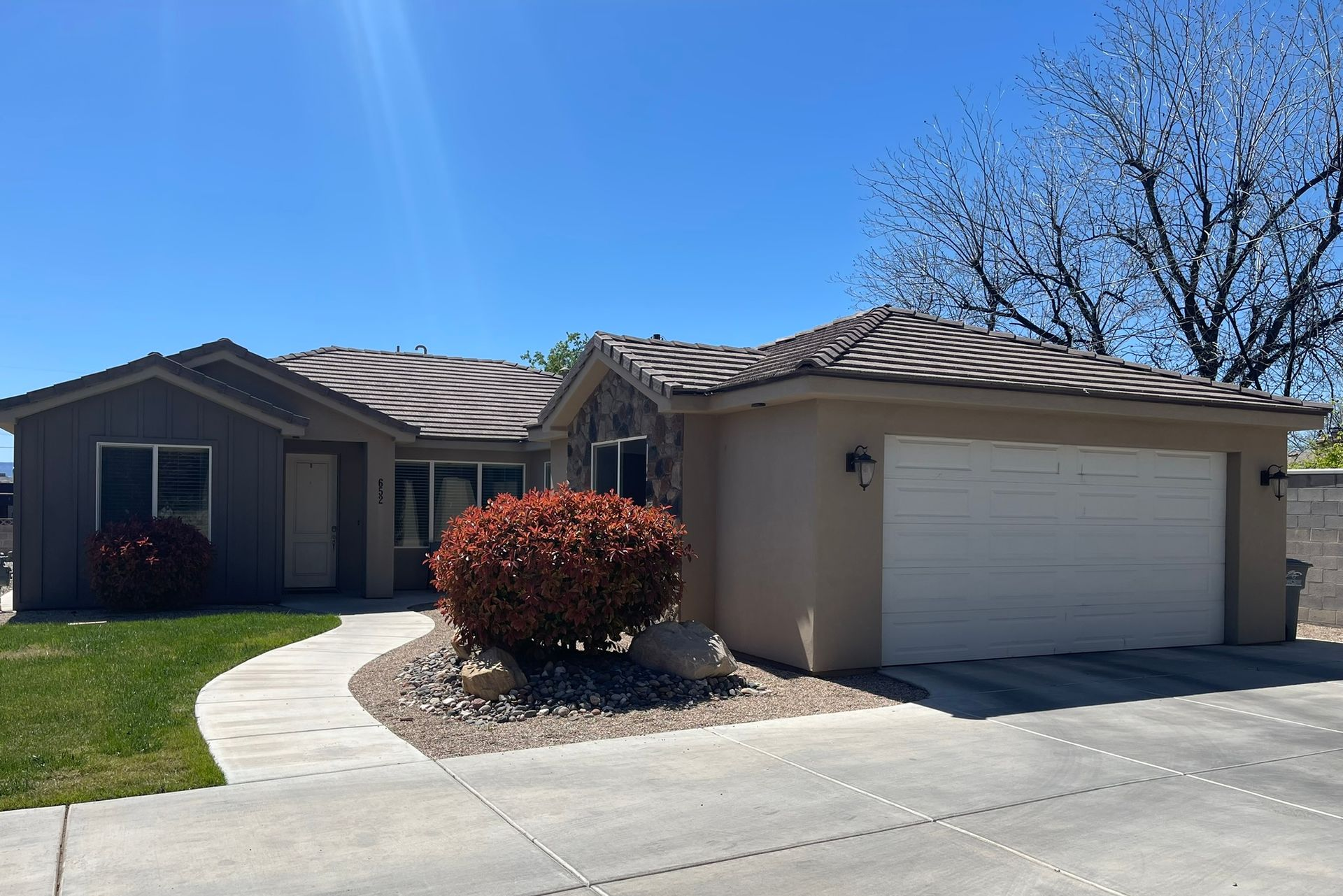 650 Complex off-campus housing near Utah Tech with large bedrooms across three houses and five units. Features in-unit laundry, spacious living areas, an outdoor grill, and yard space.