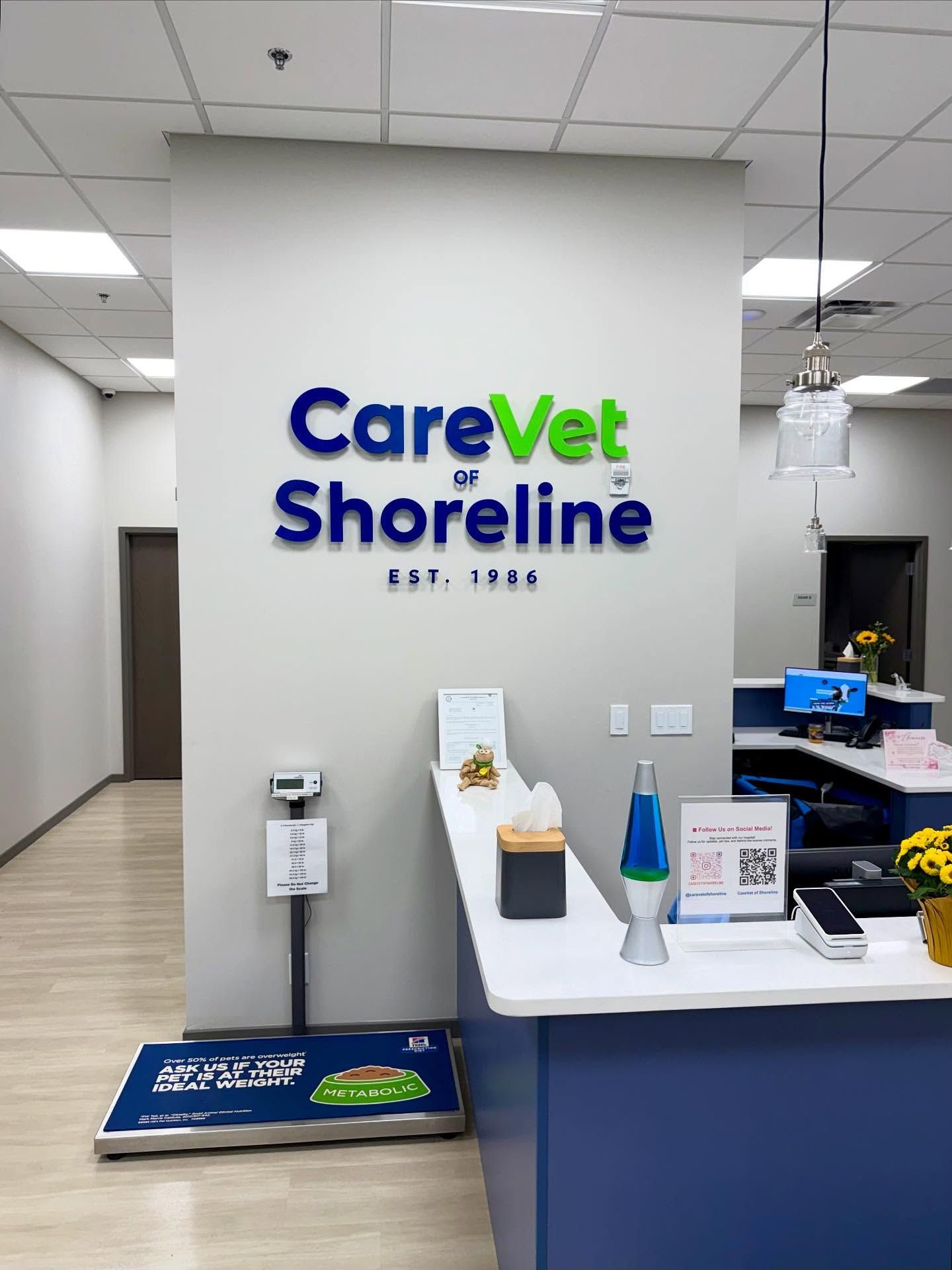 CareVet of Shoreline office entrance with logo, reception desk, and pet scale.