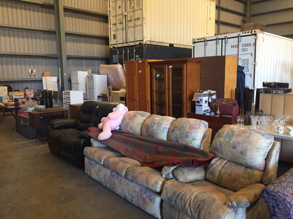 Storage Within A Warehouse Filled To Capacity With Furniture And Boxes — Dawson Moving & Storage NQ in Melbourne, VIC