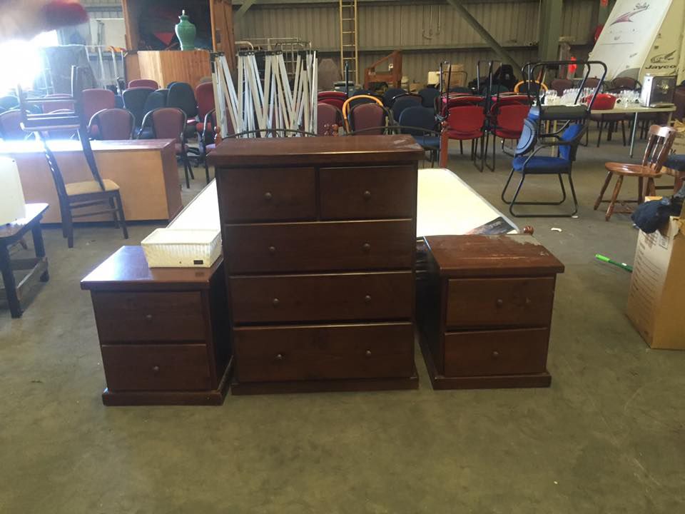 Bunch Of Chairs And Cabinets Are Place On The Warehouse Storage Area — Dawson Moving & Storage NQ in Melbourne, VIC