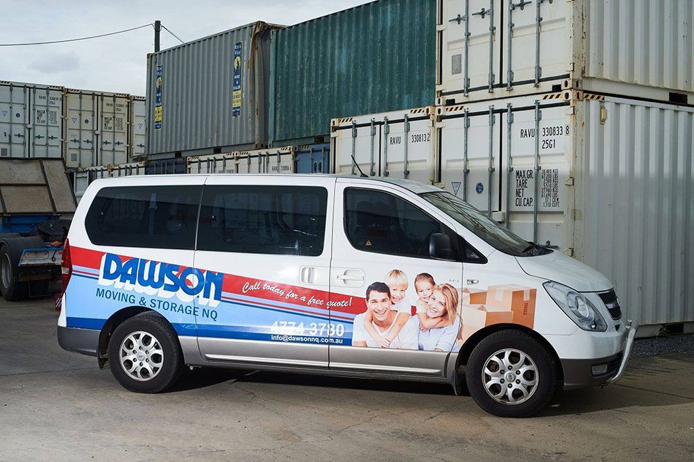 White Dawson Service Van With Storage Containers Visible In The Background — Dawson Moving & Storage NQ in Melbourne, VIC