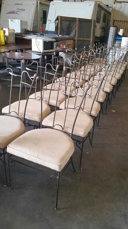 A Row of Chairs Are Lined up In a Warehouse — Dawson Moving & Storage NQ in Townsville, QLD
