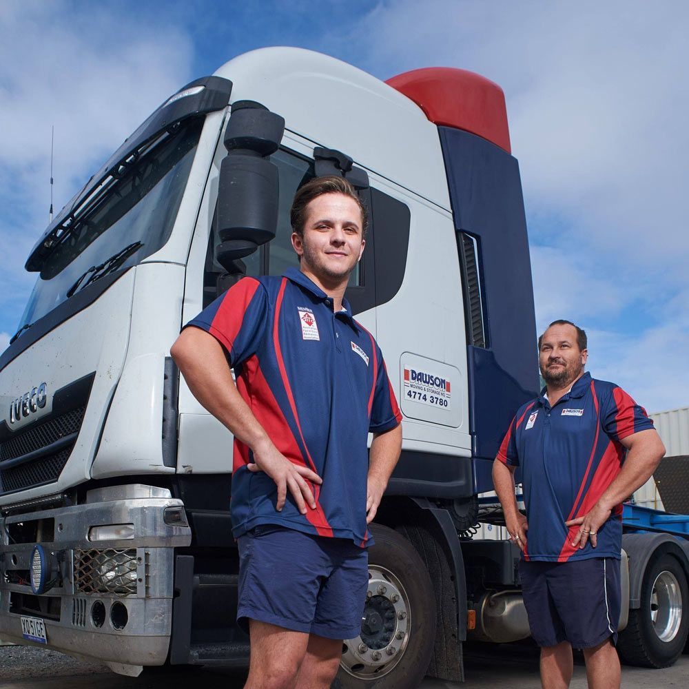 Two Men Standing In Front Of A Truck — Dawson Moving & Storage NQ in Mount St John, QLD