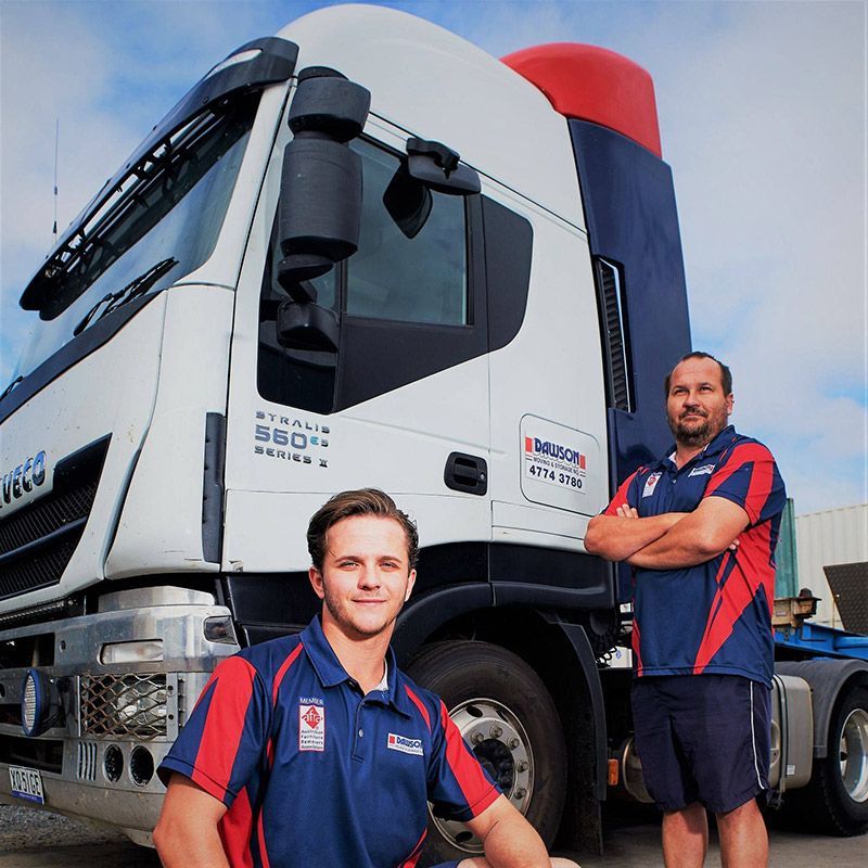 Two Men Dawson Moving Staff Standing In Front Of A Truck — Dawson Moving & Storage NQ in Mount St John, QLD