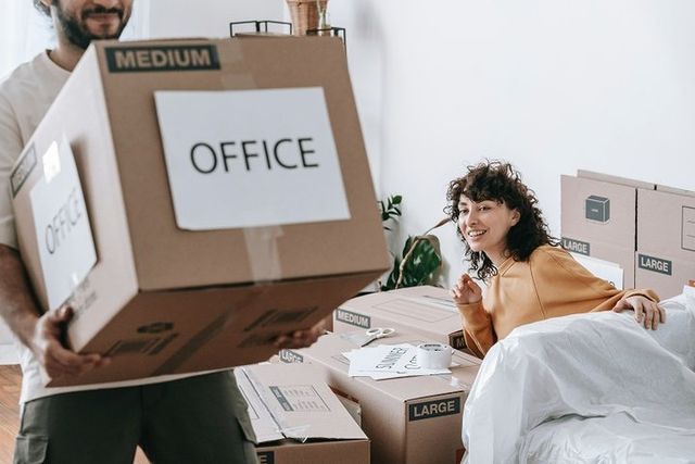 Carrying A Moving Box with The Word Office For The Office Relocation — Dawson Moving & Storage NQ in Melbourne, VIC