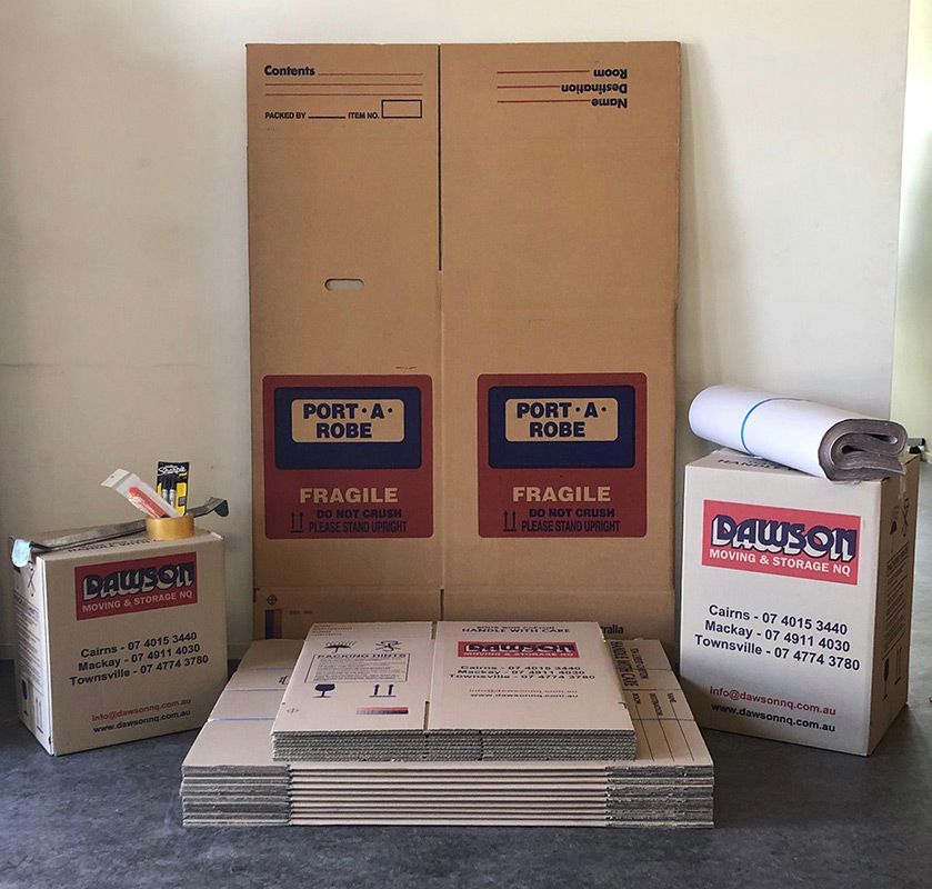 A Stack Of Cardboard Boxes That Say Dawson On Them — Dawson Moving & Storage NQ In Mount St John, QLD