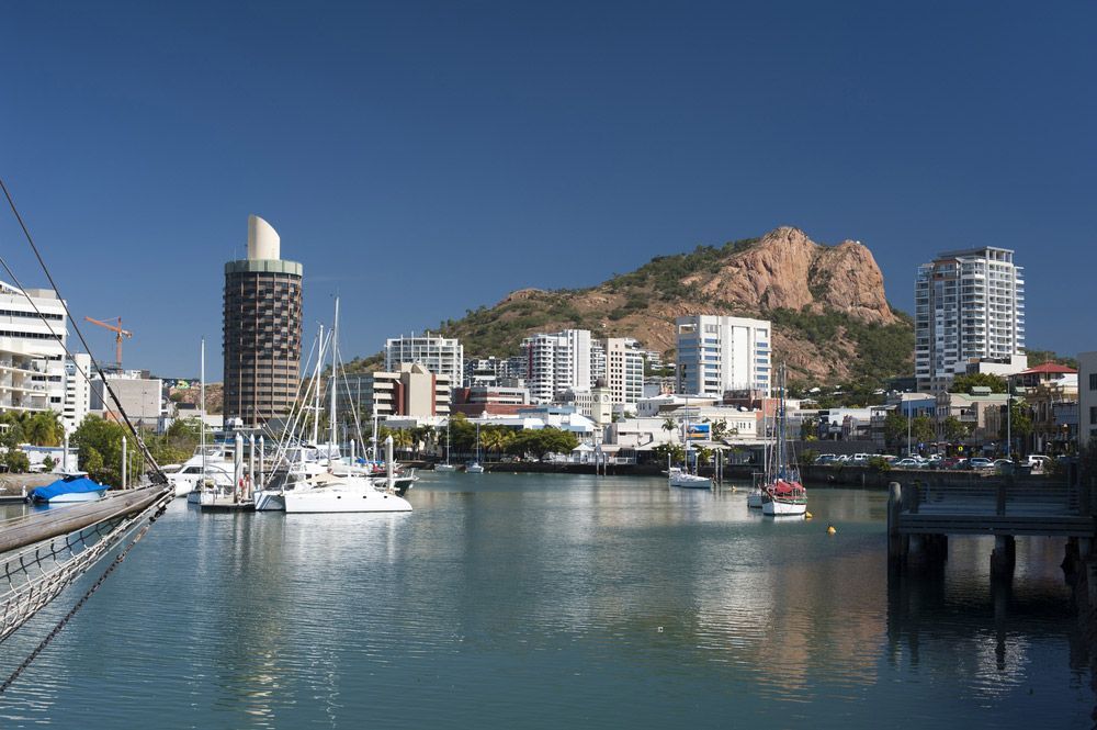 View Down The Quay Of Boats Moored In The Calm Water Of Townsville Marina In Queensland — Dawson Moving & Storage NQ in Townsville, QLD