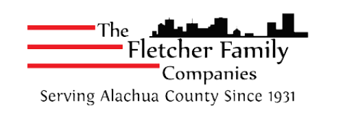 Logo for The Fletcher Family Companies, featuring red lines, a black skyline, and text about serving Alachua County since 1931.