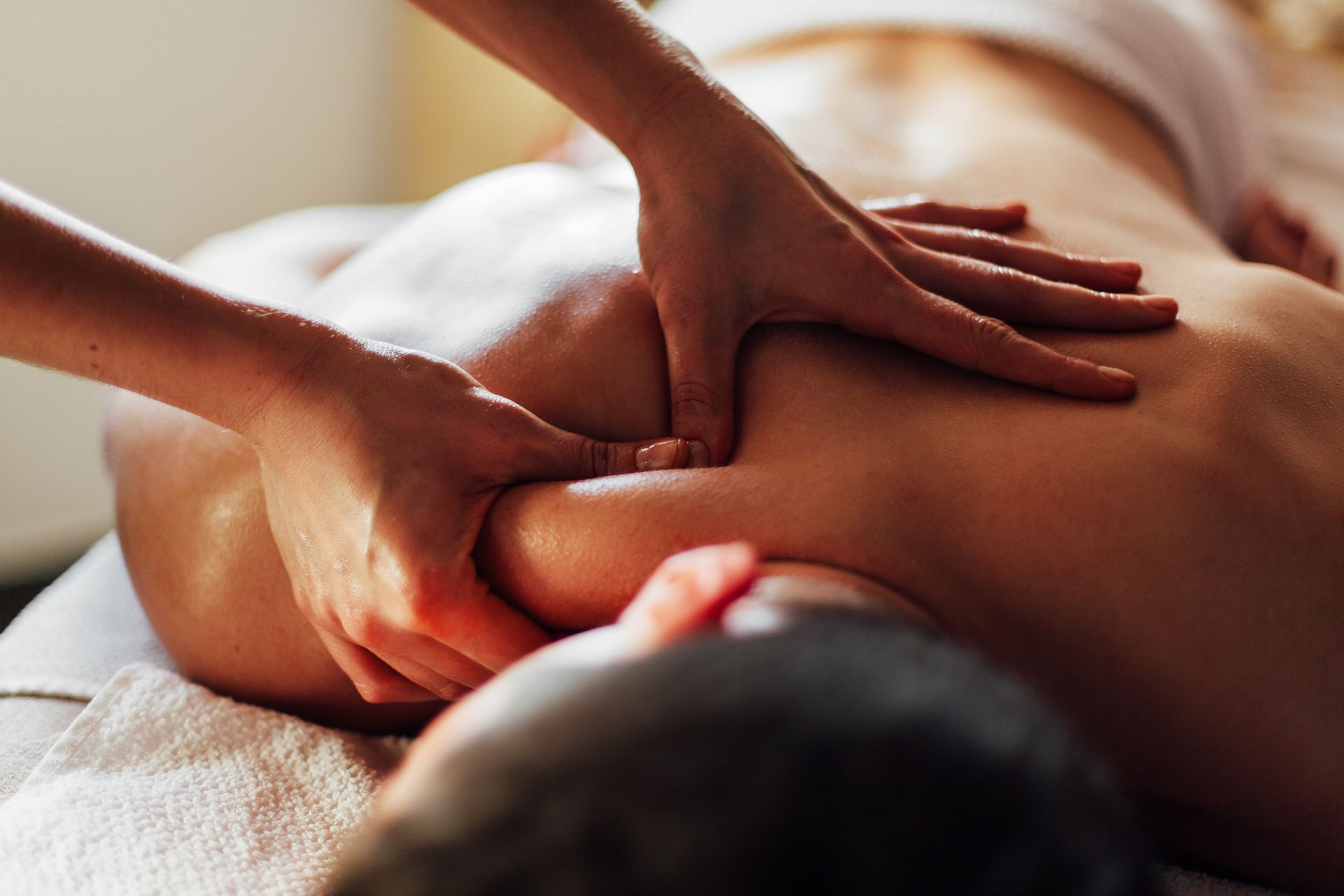 A man is getting a massage at a spa.
