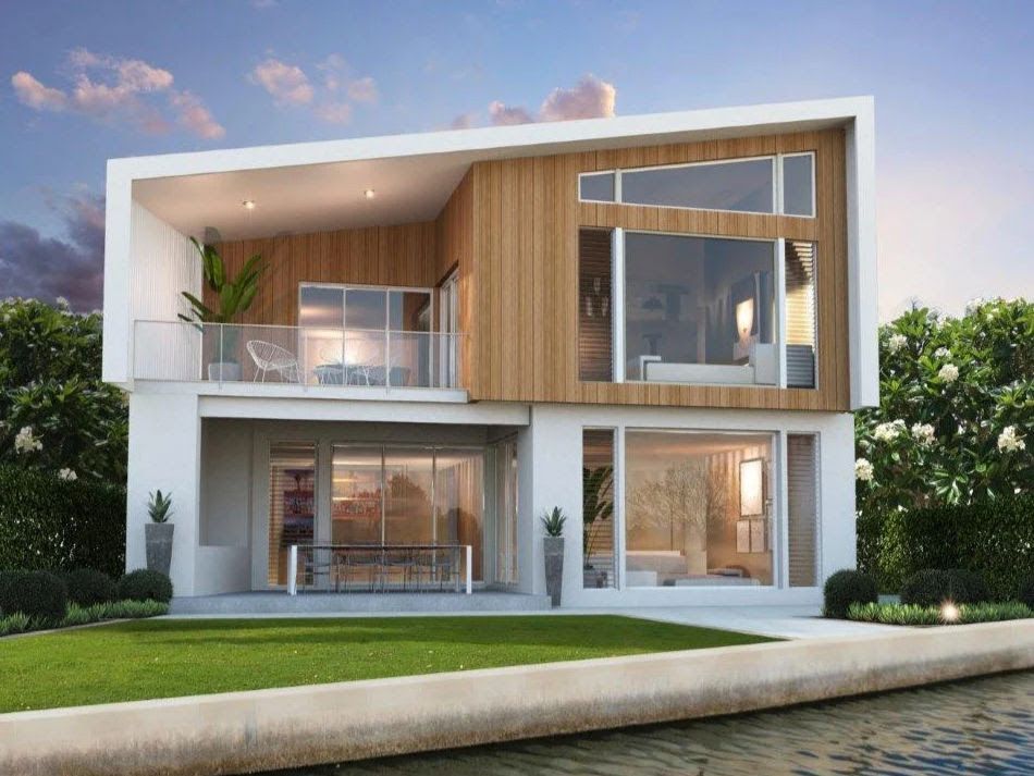 Modern two-story house with white exterior, wood accents, and large windows, next to a waterway.