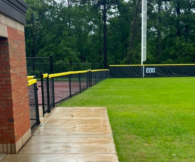 A baseball field with the number 200 on the fence